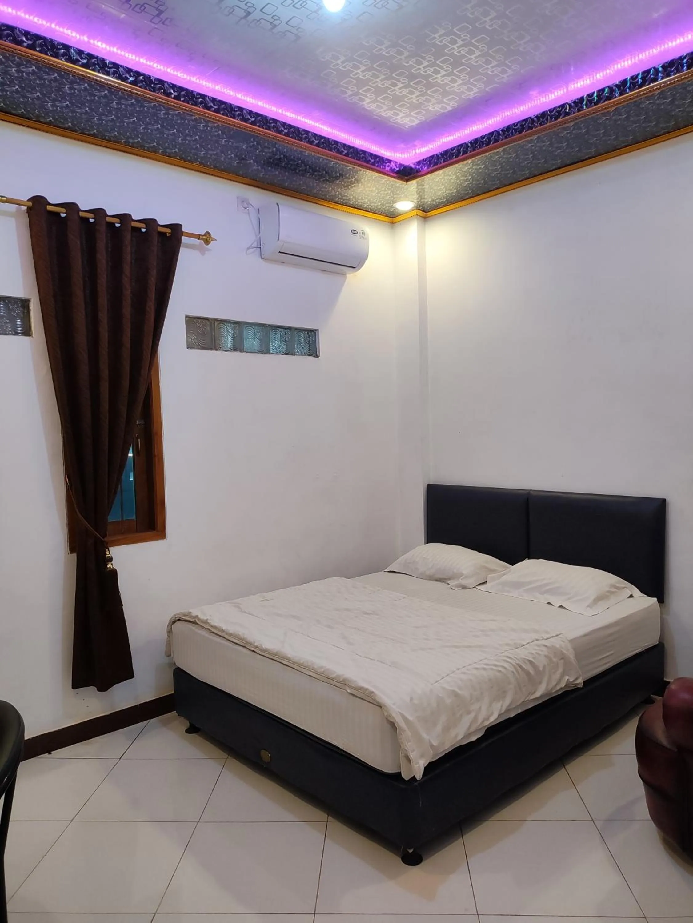 Bed in Penginapan Nurmega jaya