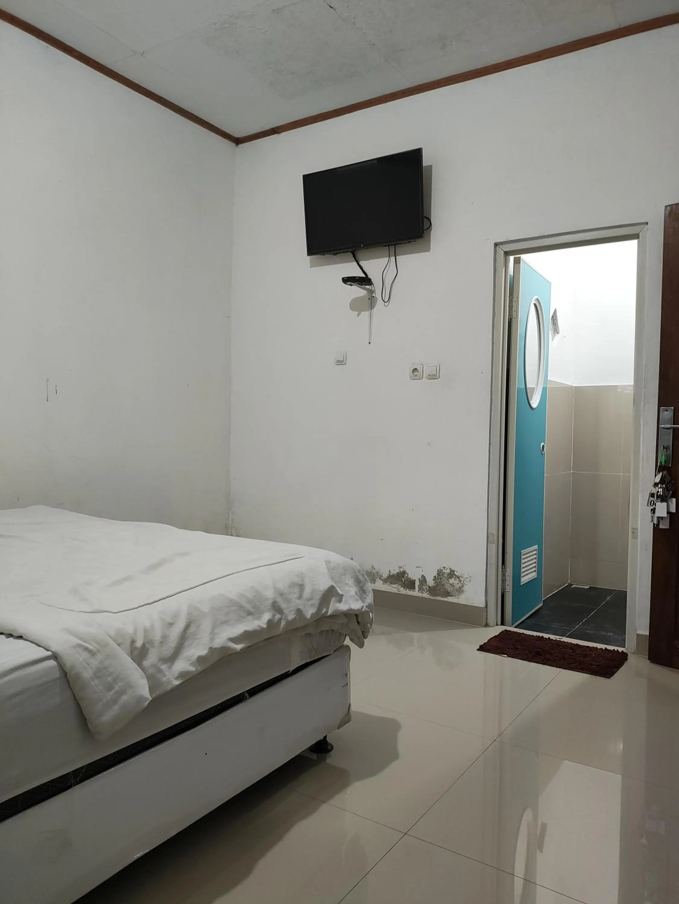 Bed in Penginapan Nurmega jaya
