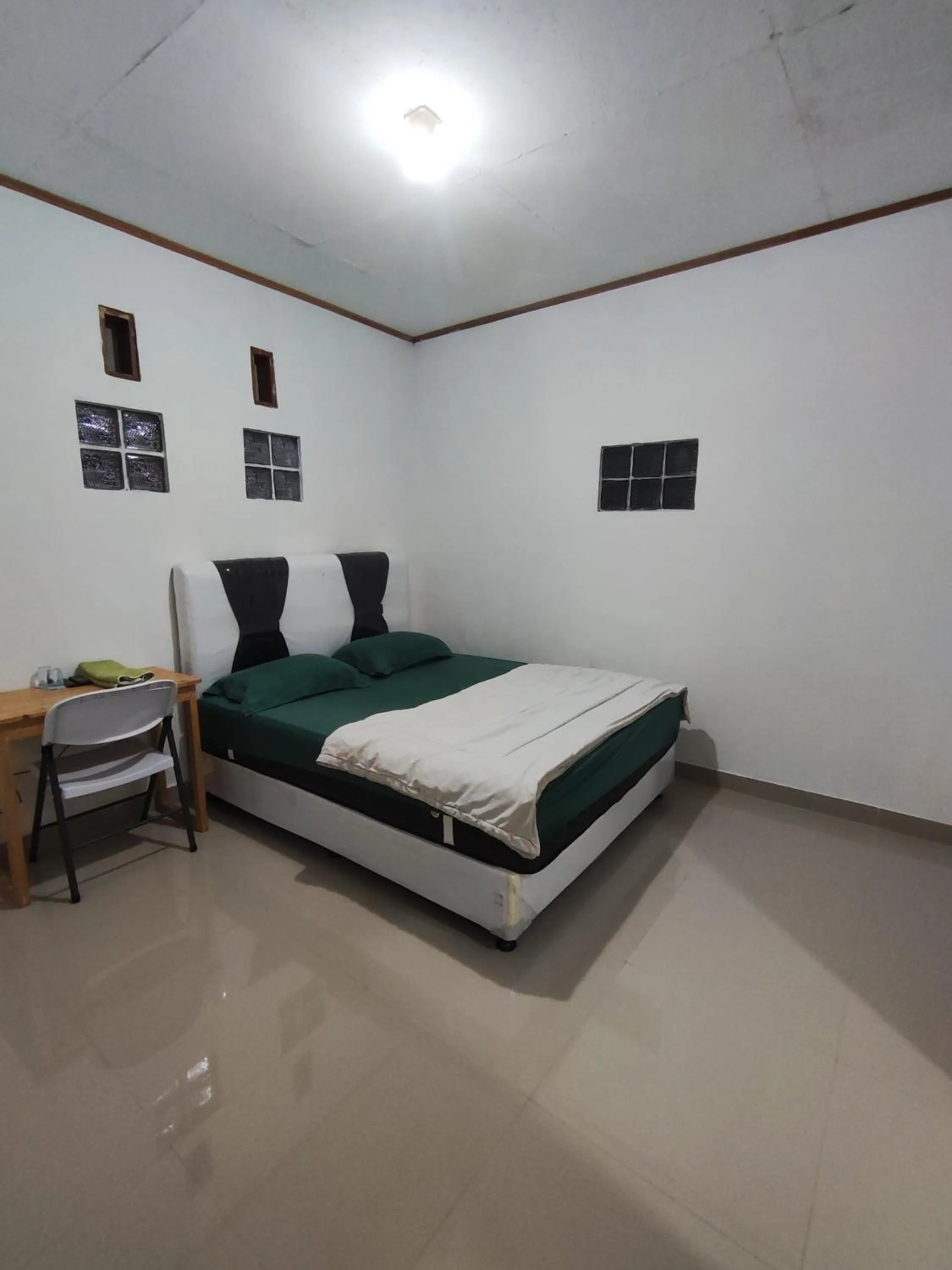Bed in Penginapan Nurmega jaya