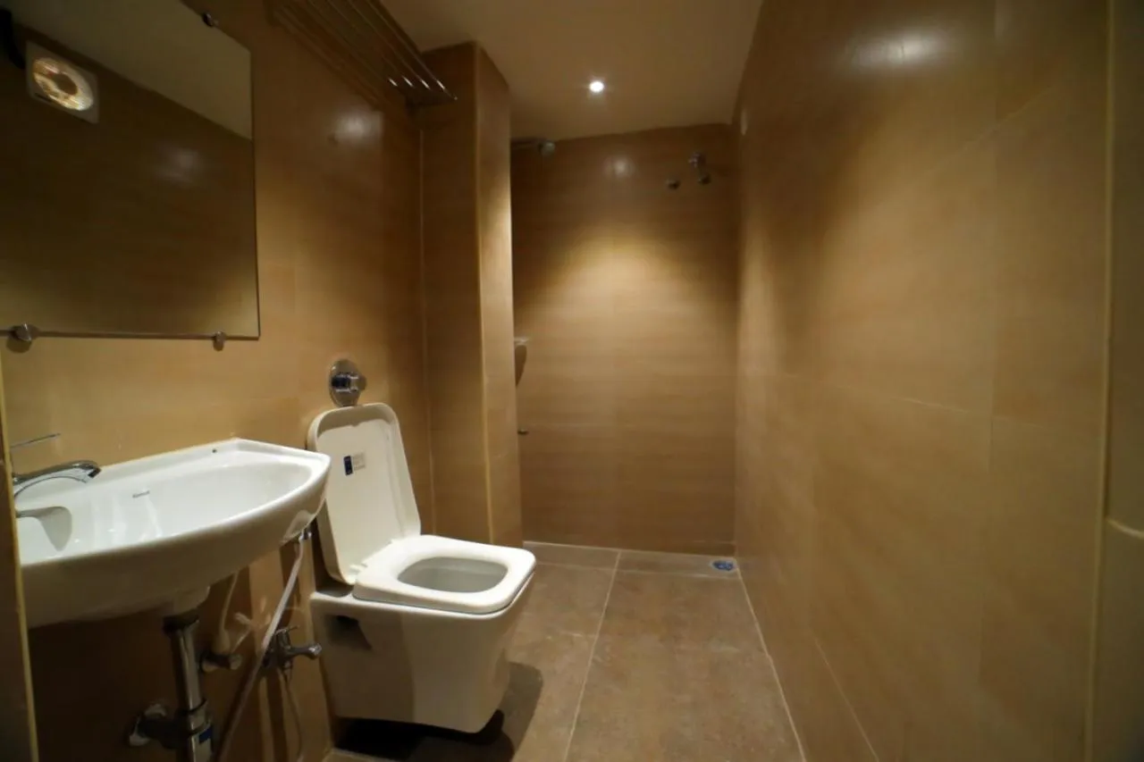 Bathroom in beeStay Hotels MG Road Vijayawada