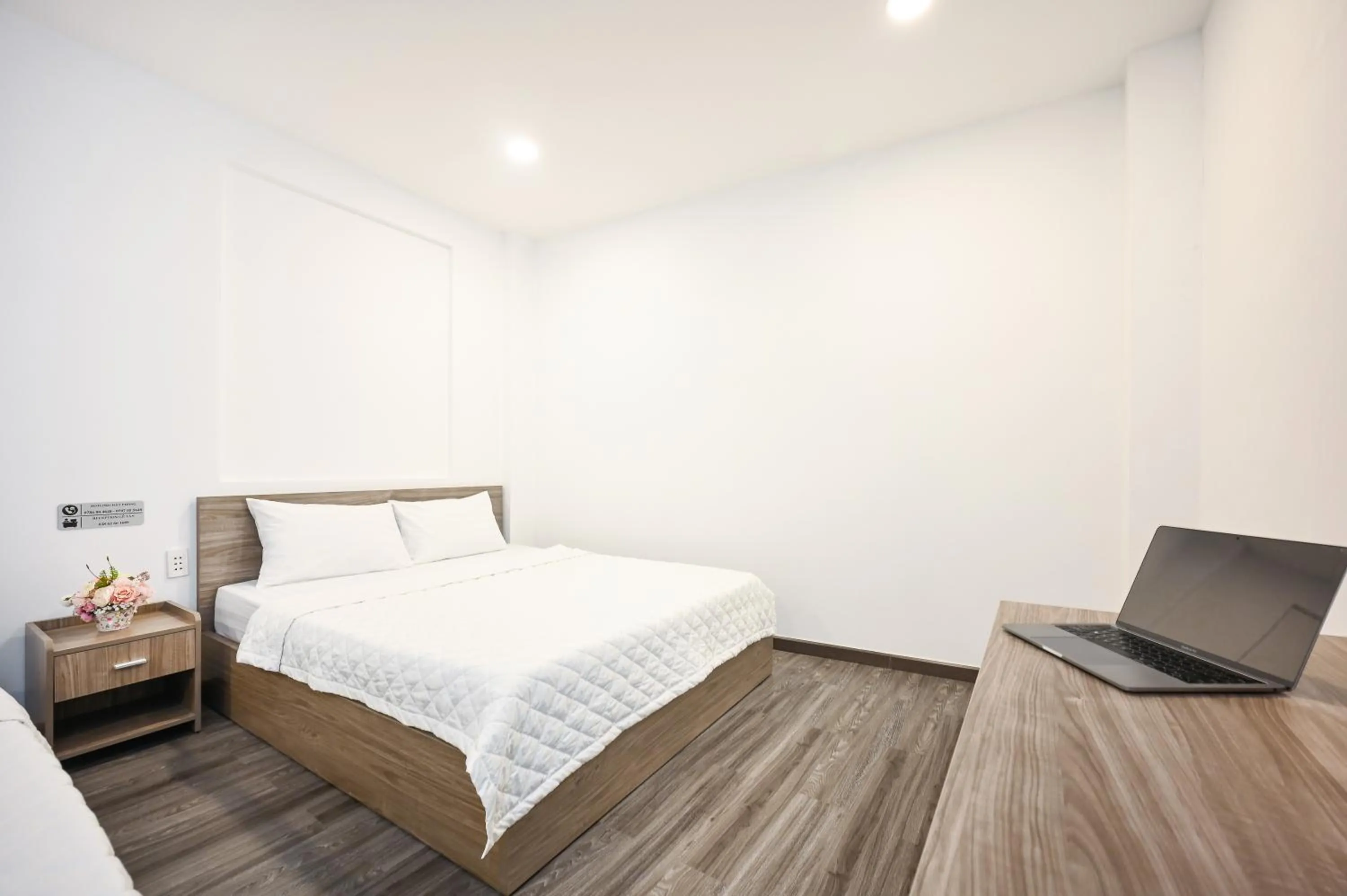 Bed in YoKo Airport Saigon Hotel