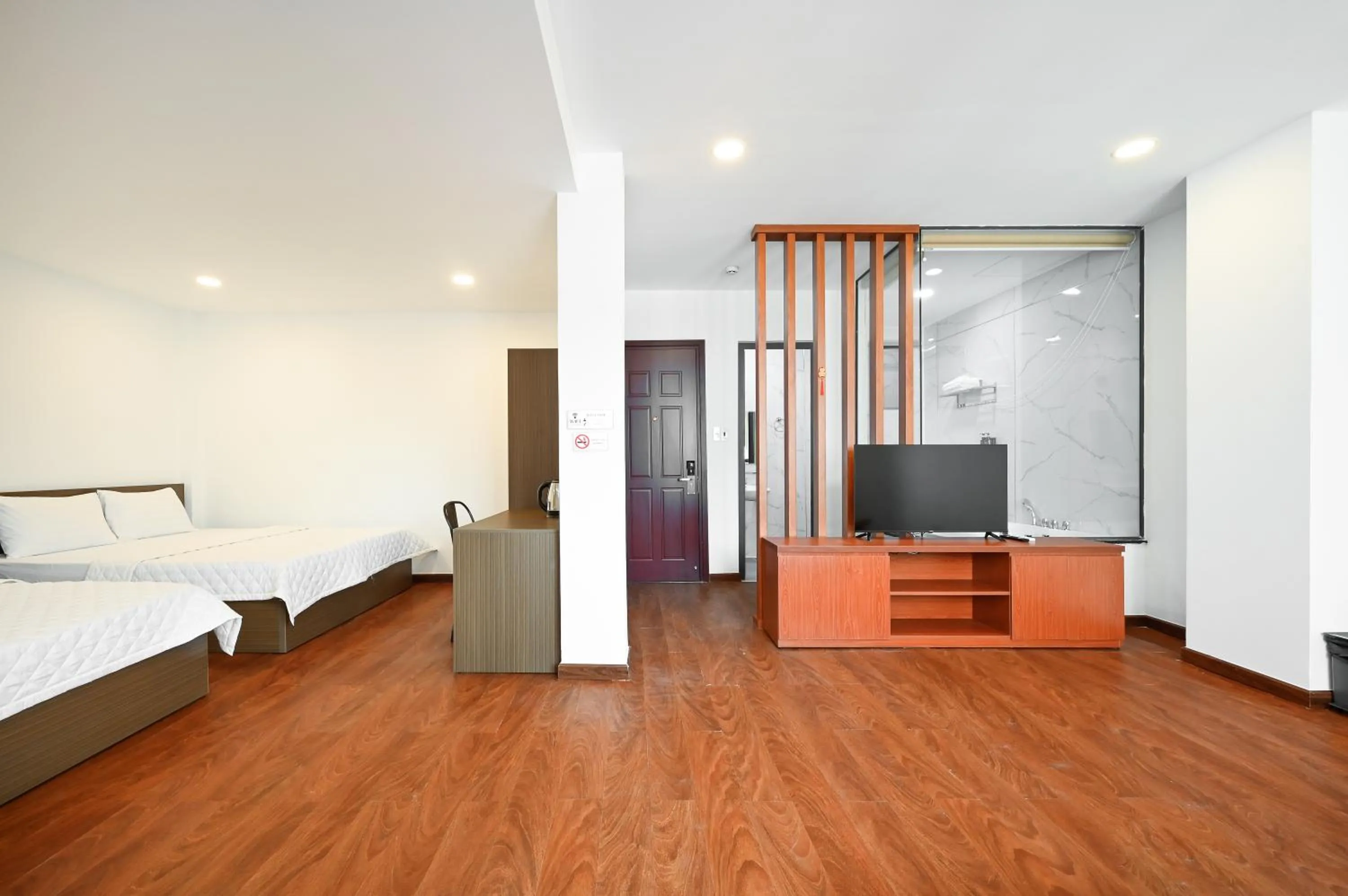 Photo of the whole room, Bed in YoKo Airport Saigon Hotel