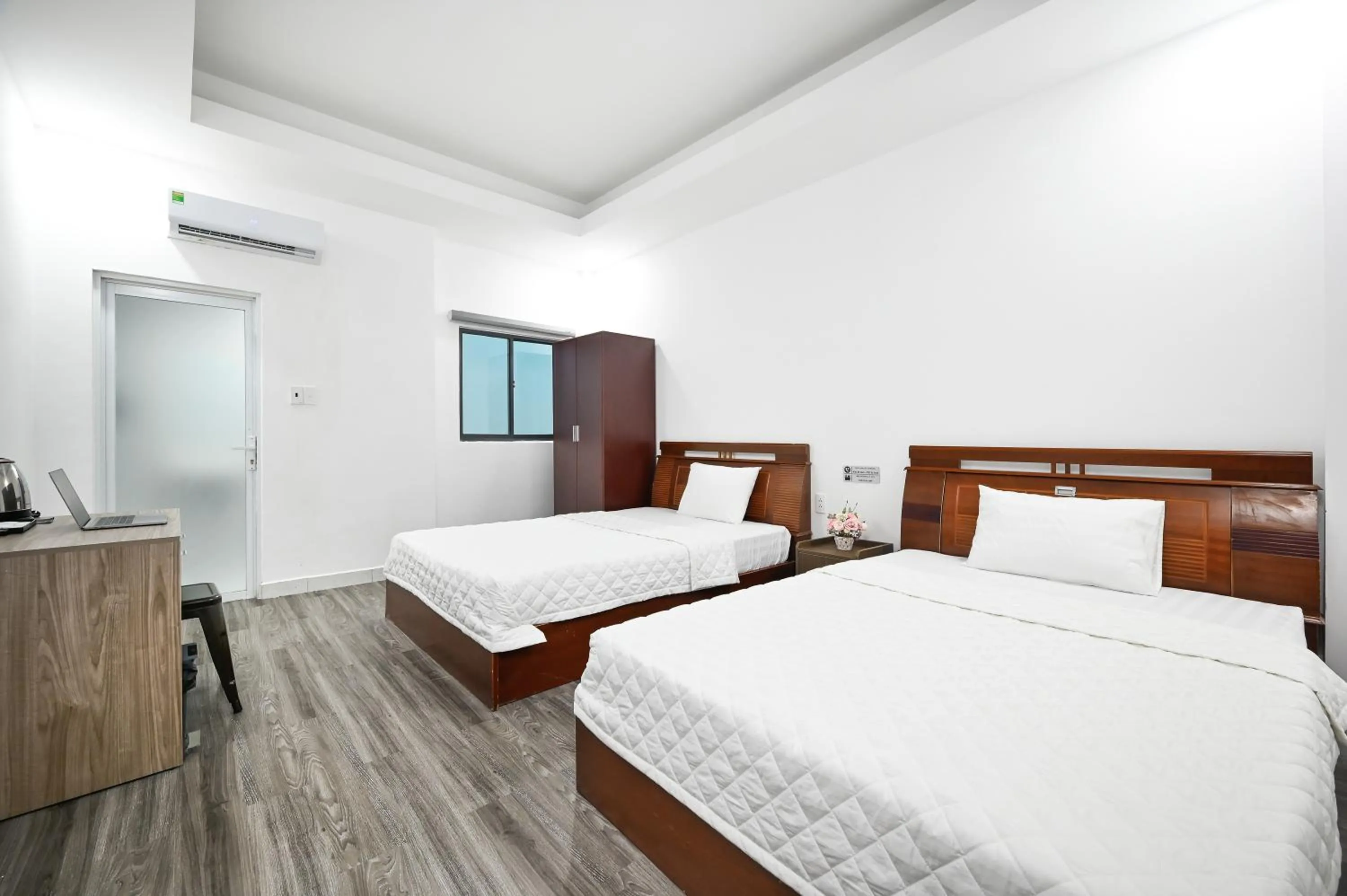 Bed in YoKo Airport Saigon Hotel