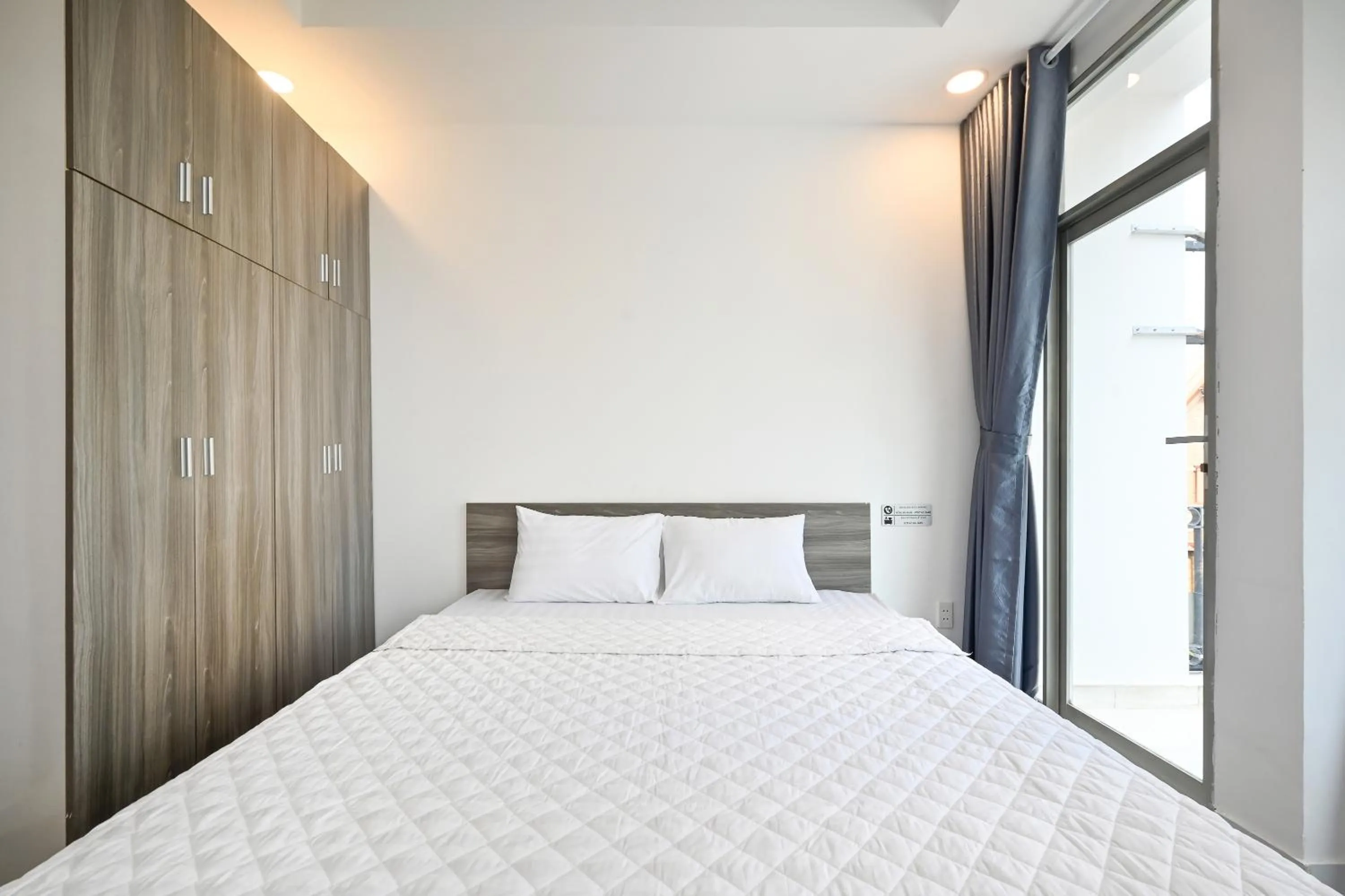 Bed in YoKo Airport Saigon Hotel