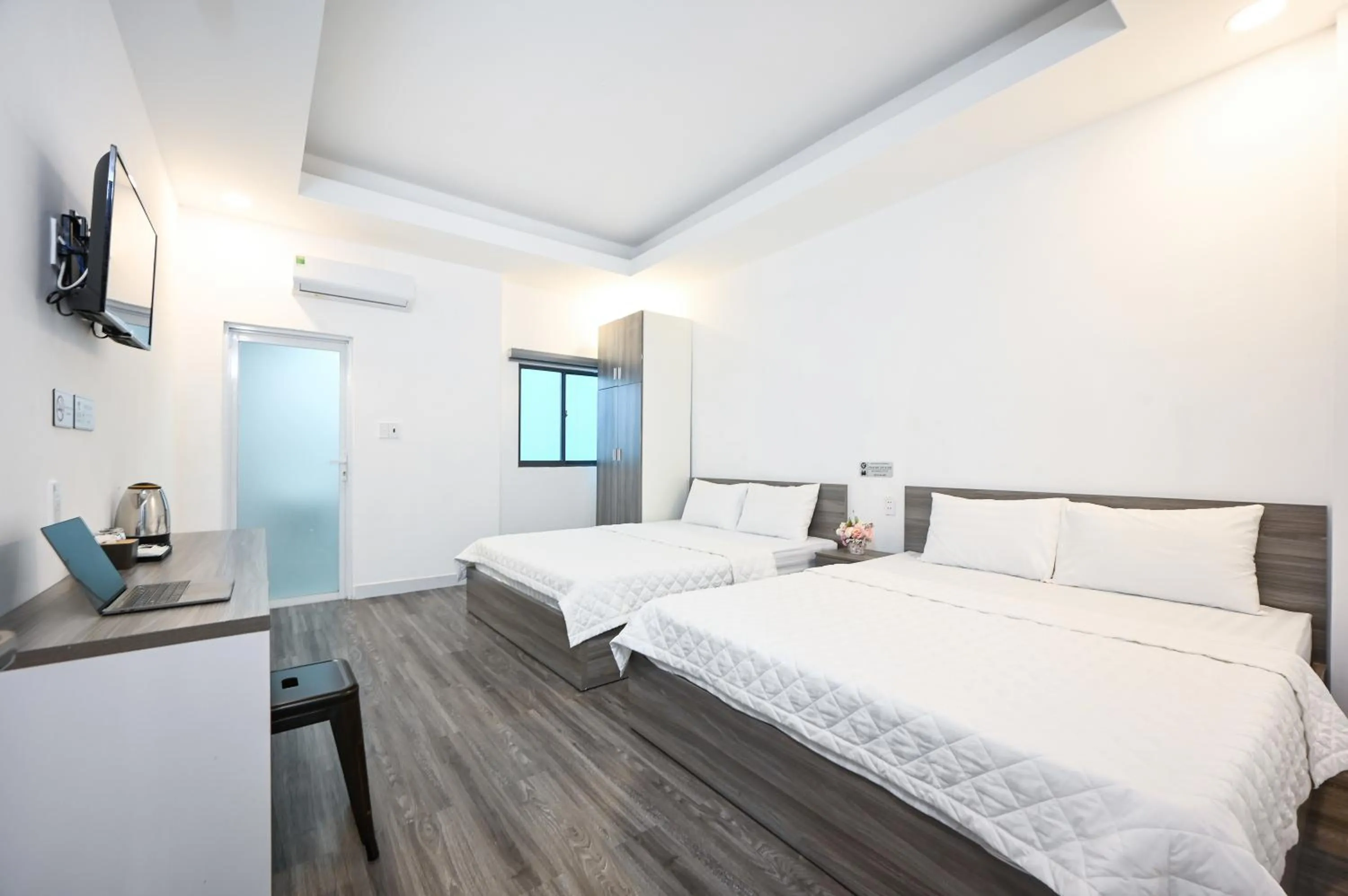 Bed in YoKo Airport Saigon Hotel