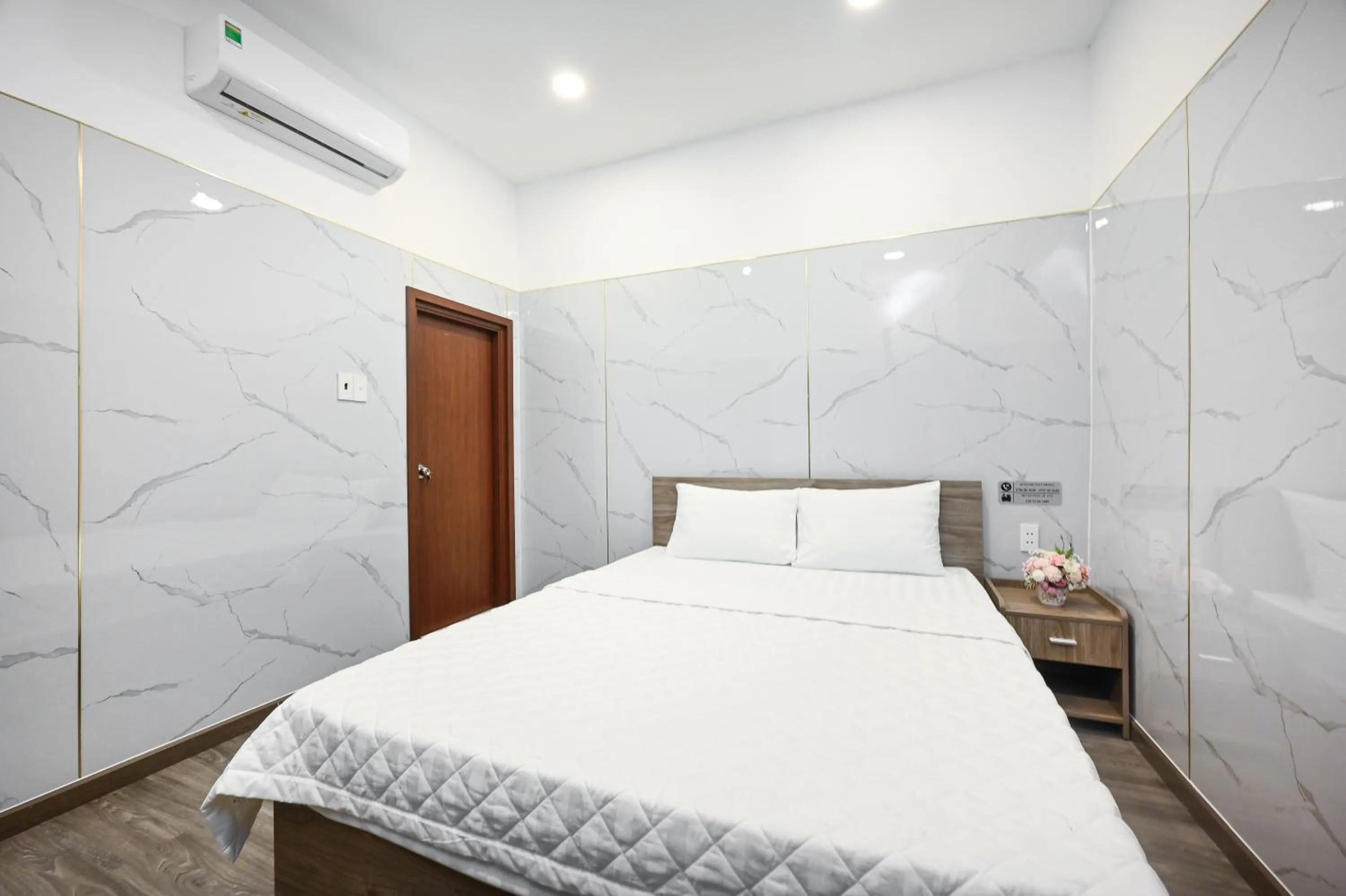 Bed in YoKo Airport Saigon Hotel