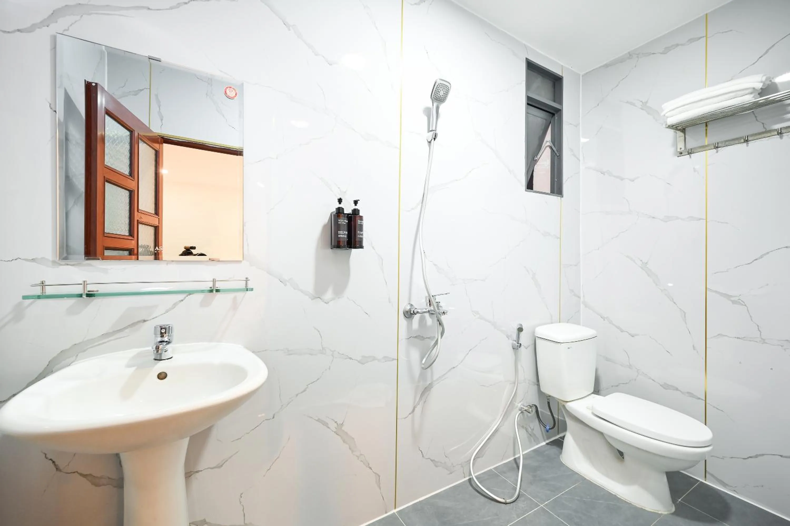 Toilet in YoKo Airport Saigon Hotel