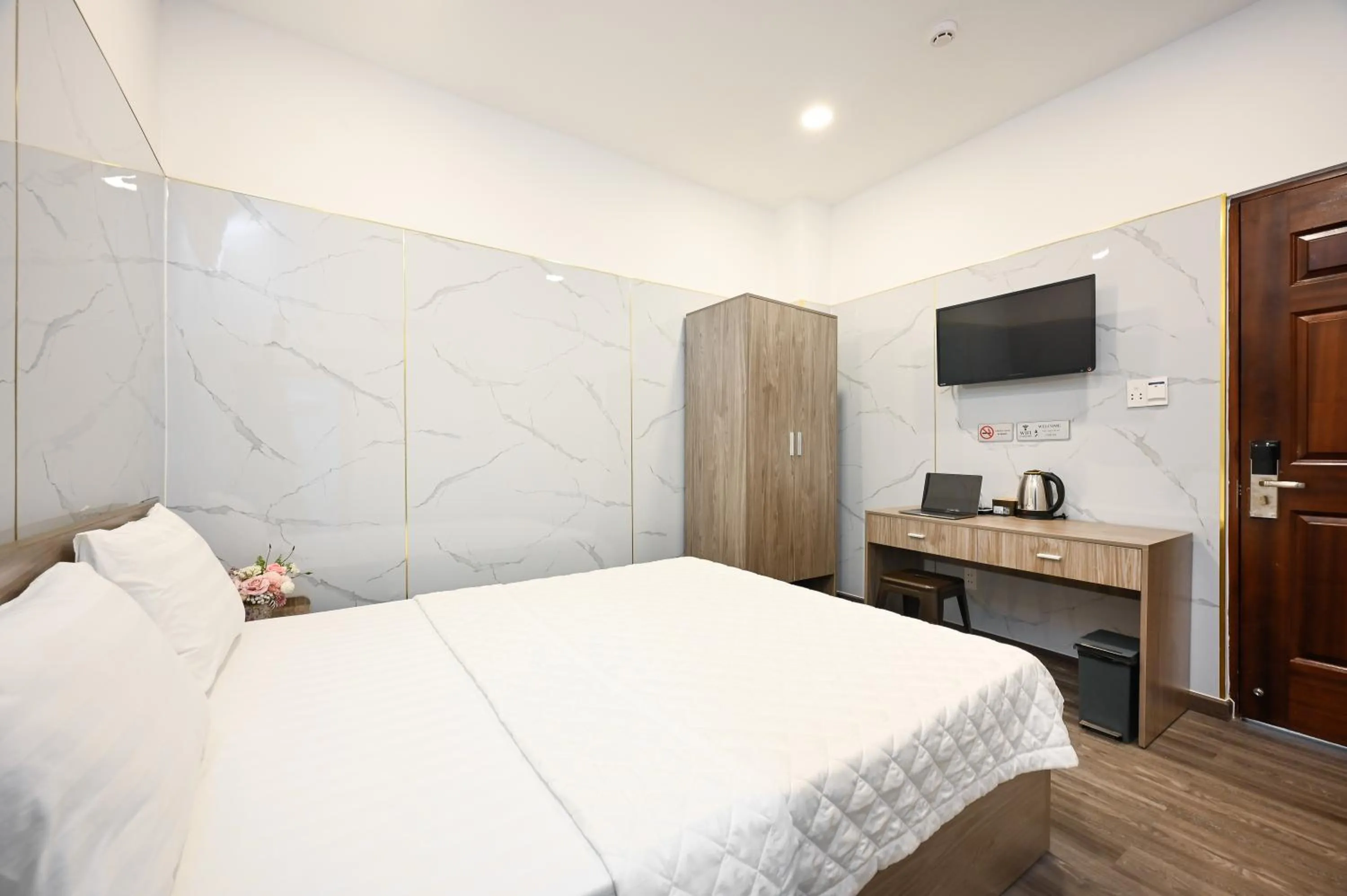 Bed in YoKo Airport Saigon Hotel