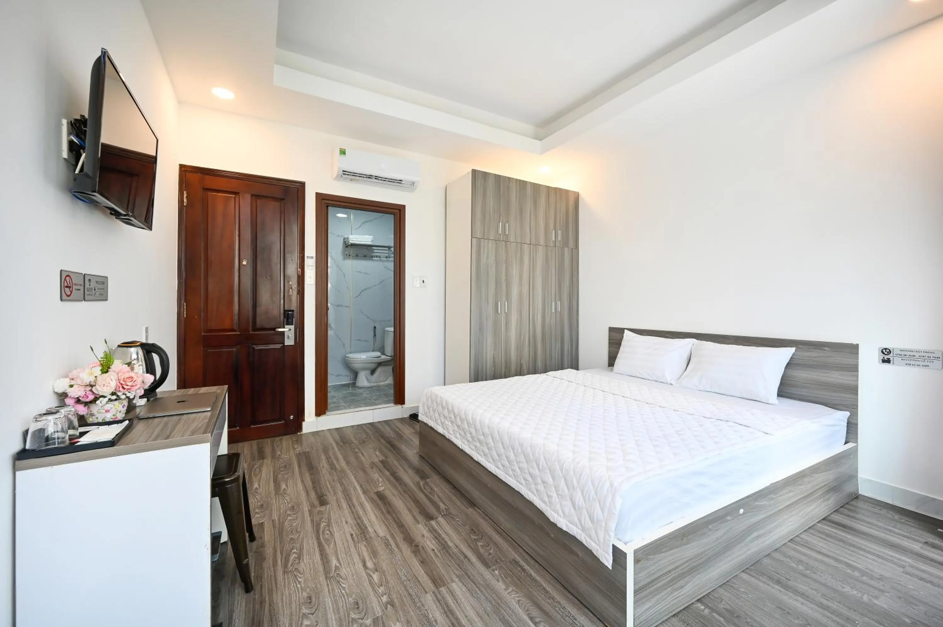 Bed in YoKo Airport Saigon Hotel