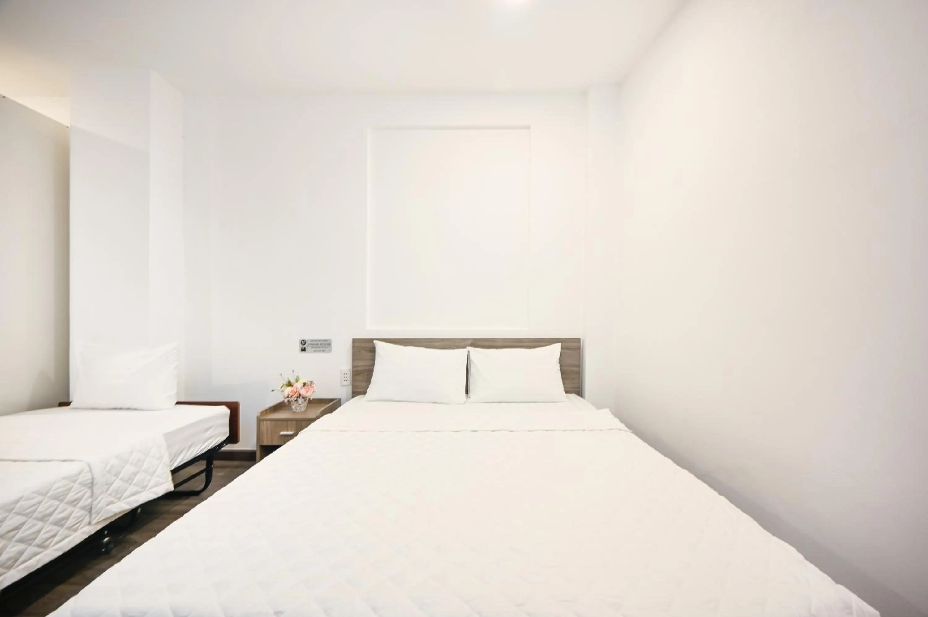 Bed in YoKo Airport Saigon Hotel