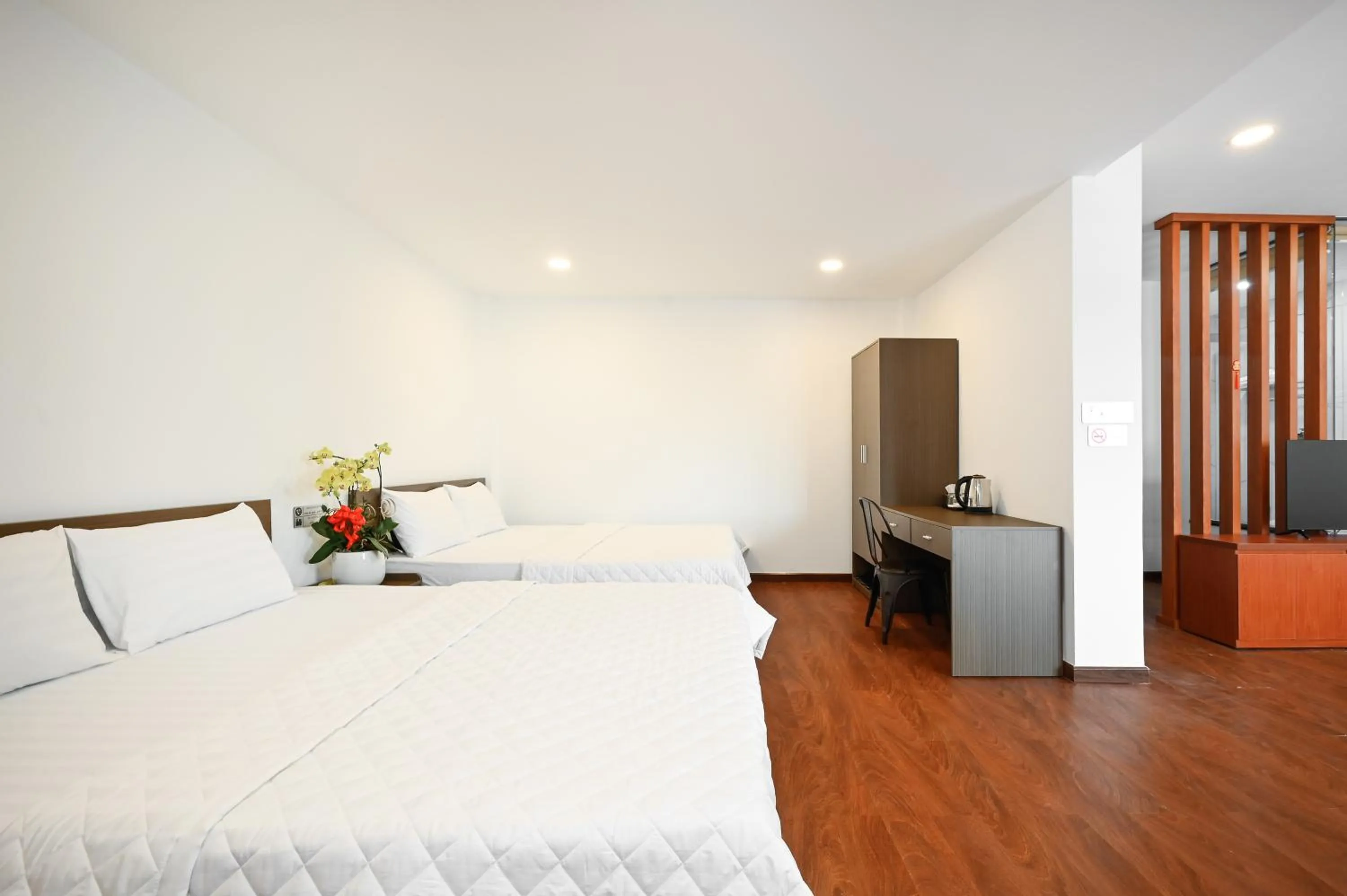 Bed in YoKo Airport Saigon Hotel