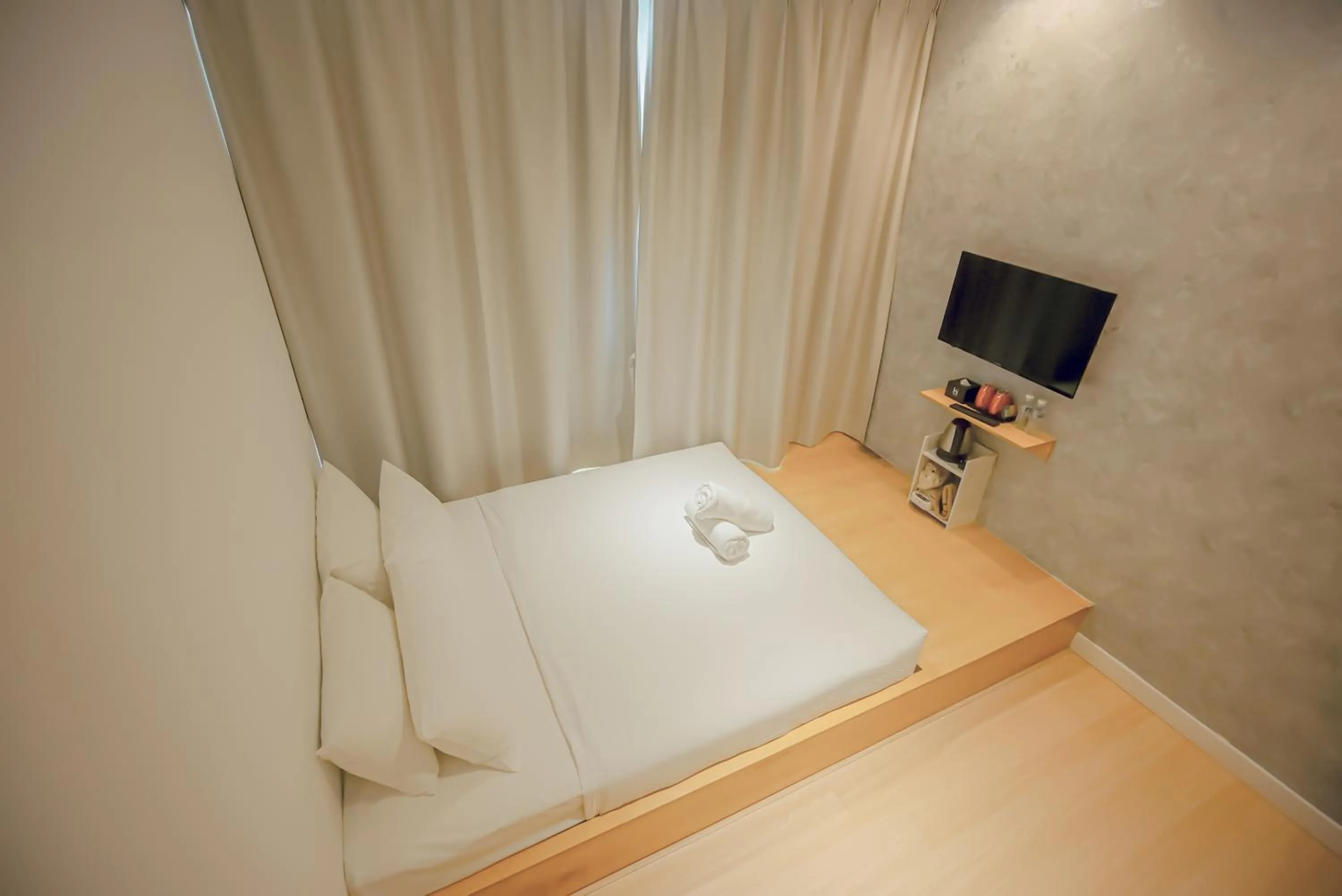 Bed in Double H Boutique Hotel