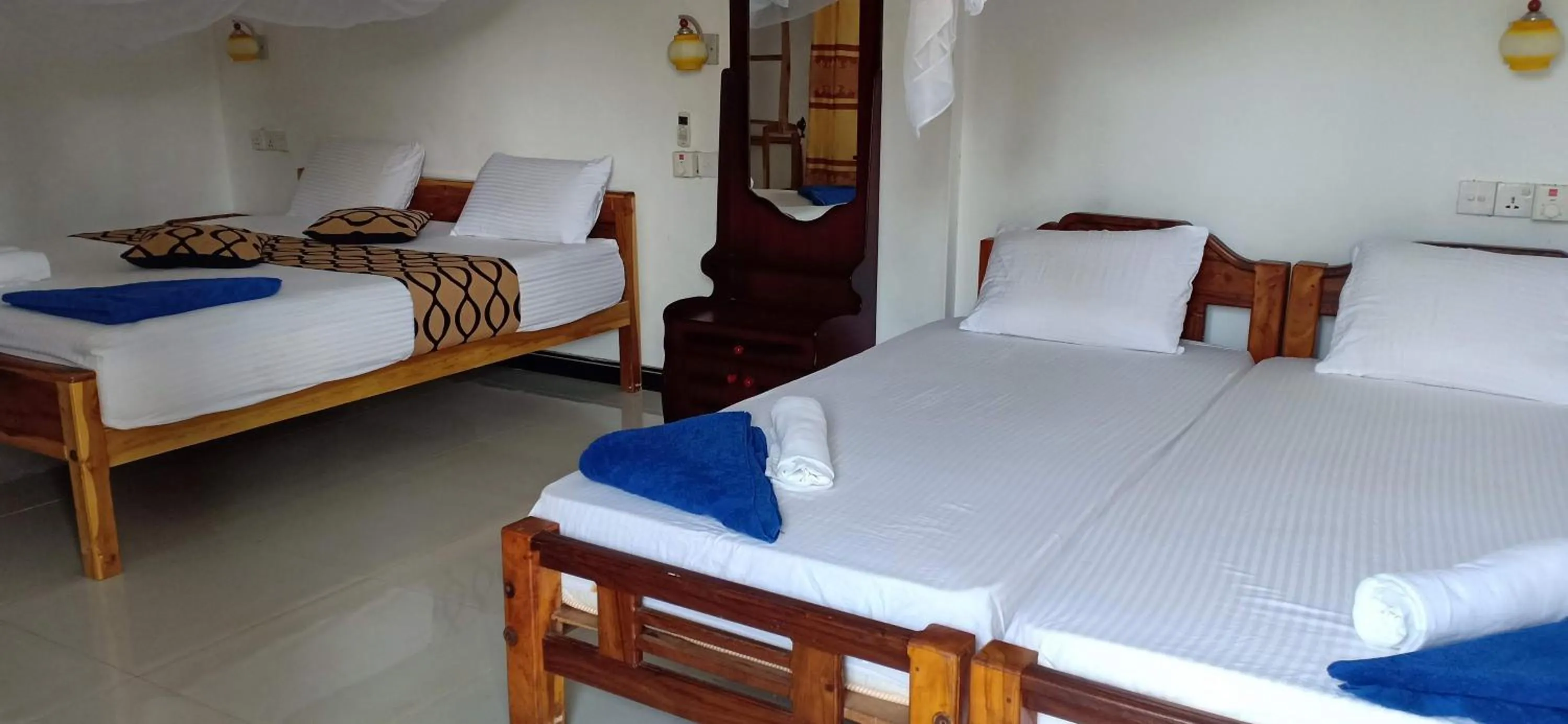 Bed in SURF & SAND Hotel Arugambay