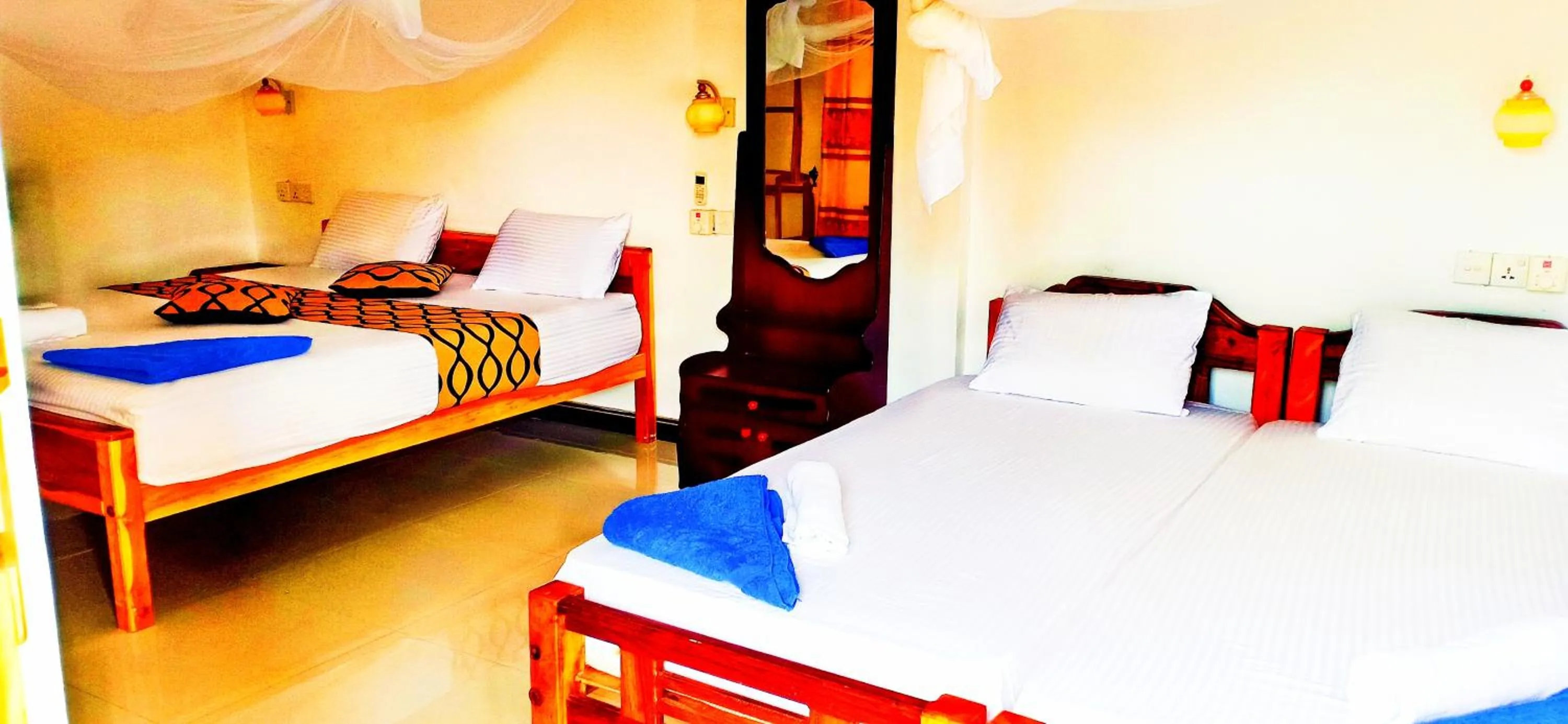 Bed in SURF & SAND Hotel Arugambay