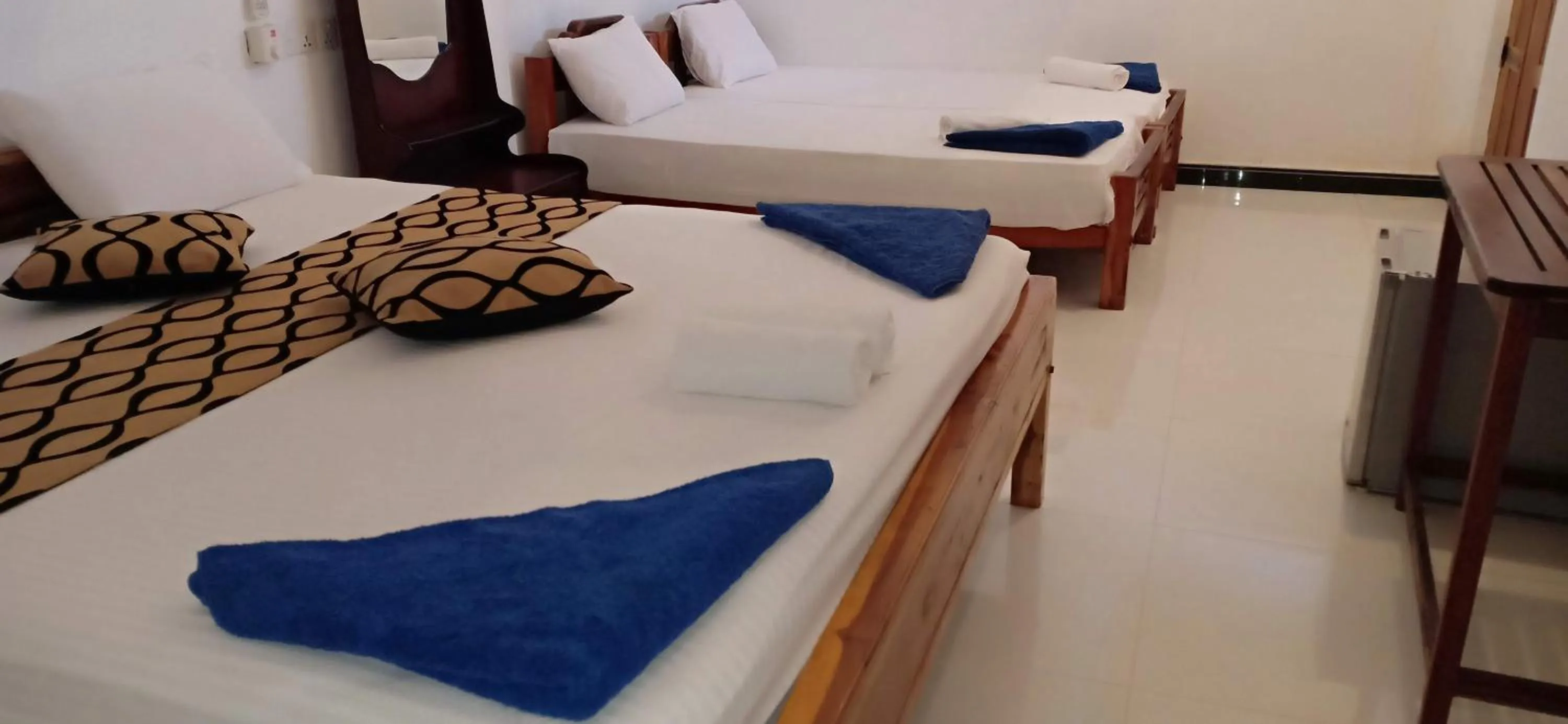Bed in SURF & SAND Hotel Arugambay