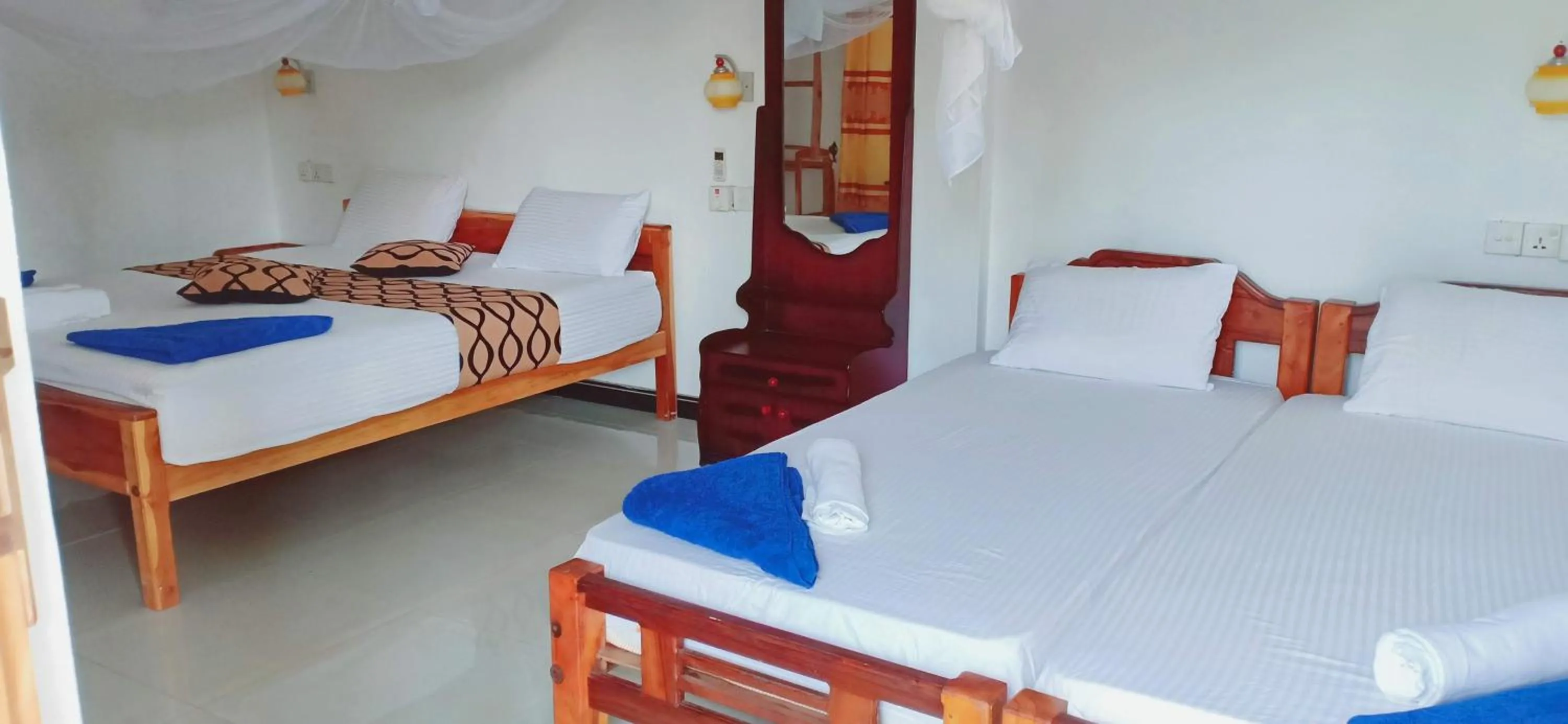 Bed in SURF & SAND Hotel Arugambay
