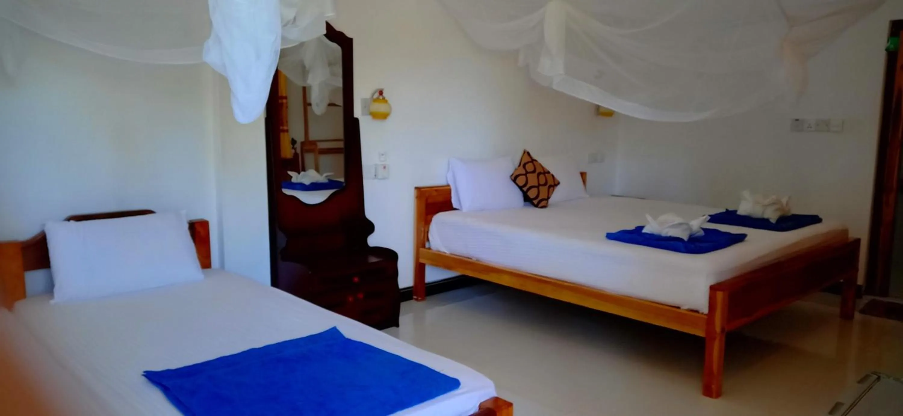 Bed in SURF & SAND Hotel Arugambay