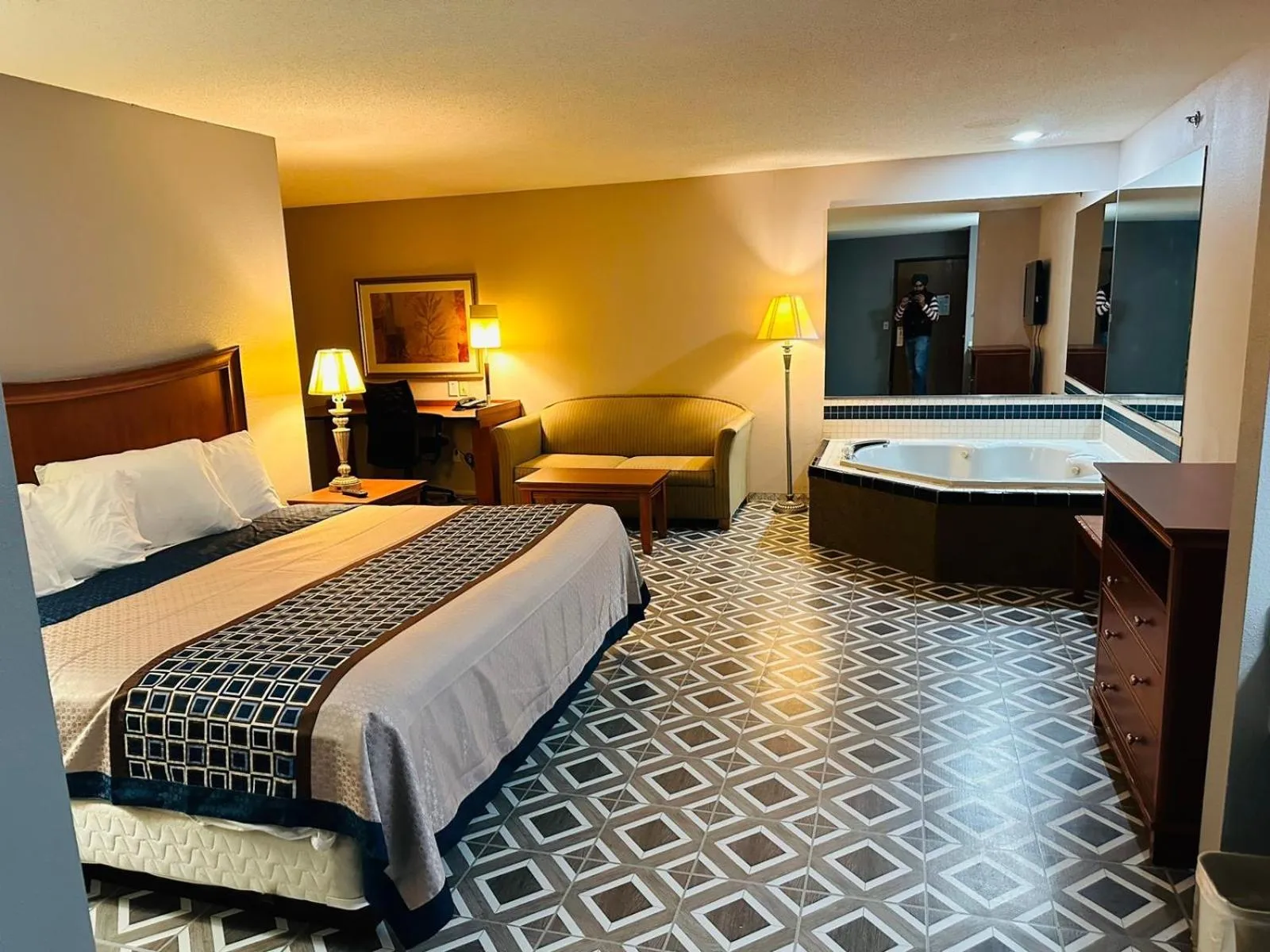 Bed in Royal Inn Suites