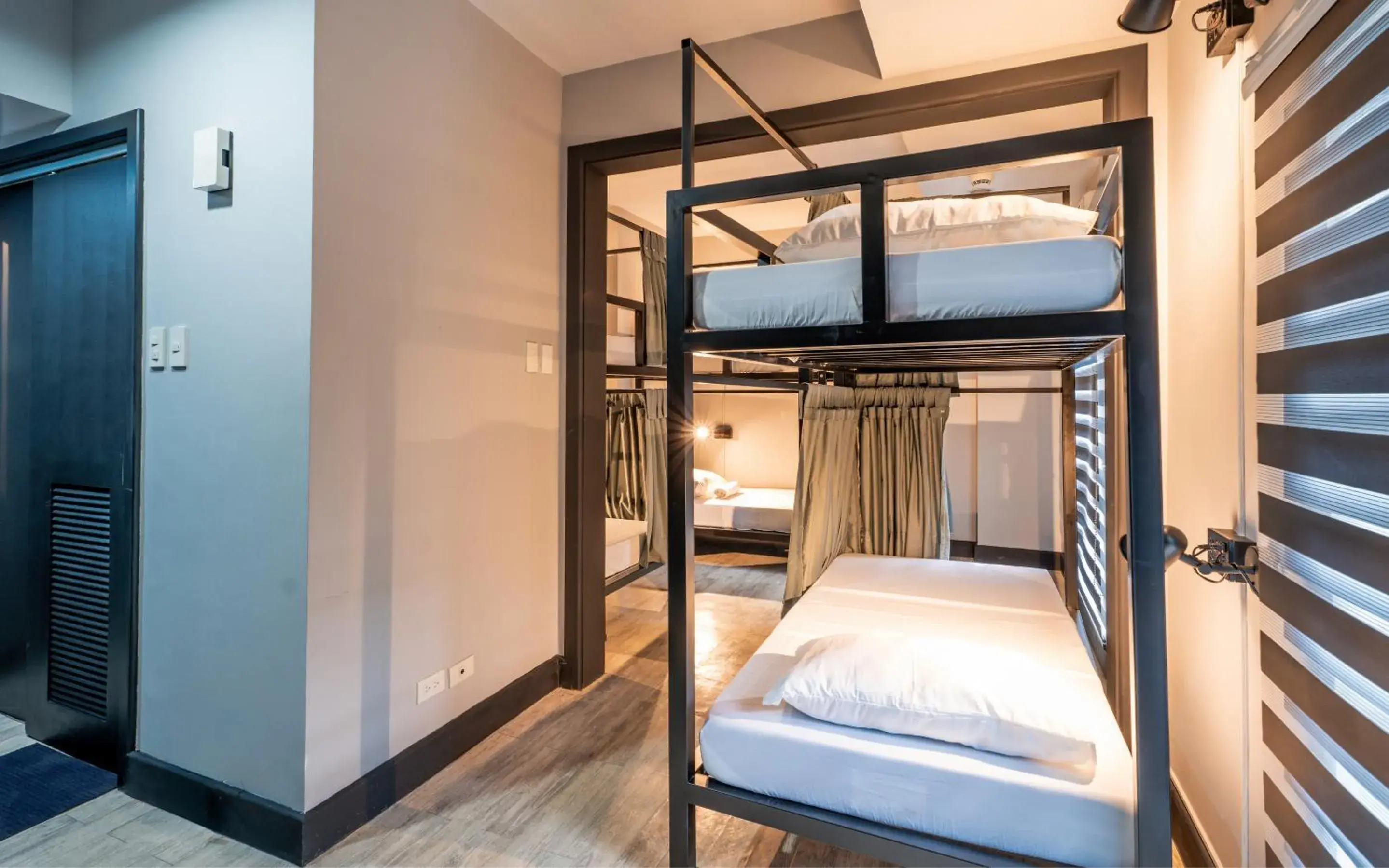 Bed in 6-Bed Dormitory Room in Mad Monkey Manila Bed in 6-Bed Dormitory Room in Mad Monkey Manila