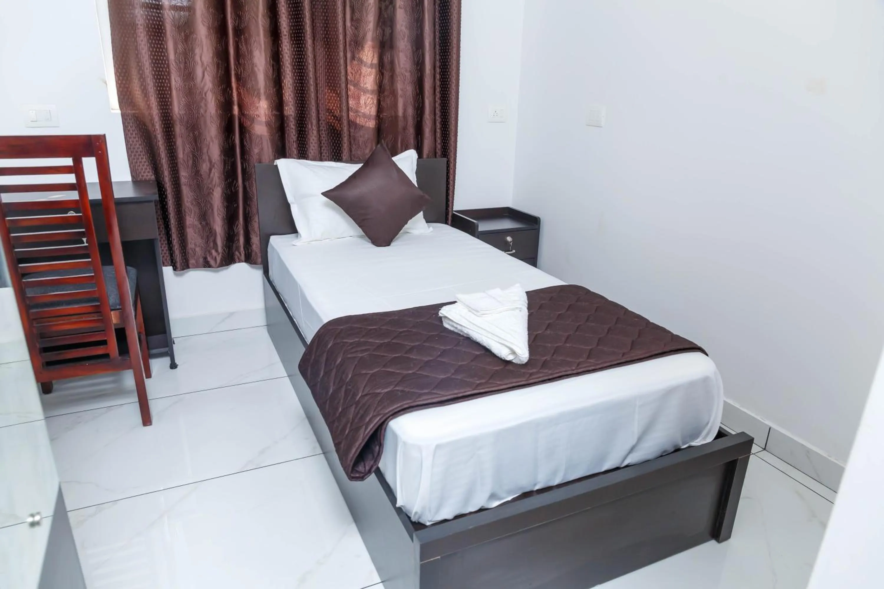 Bed in Guest West Inn Cochin