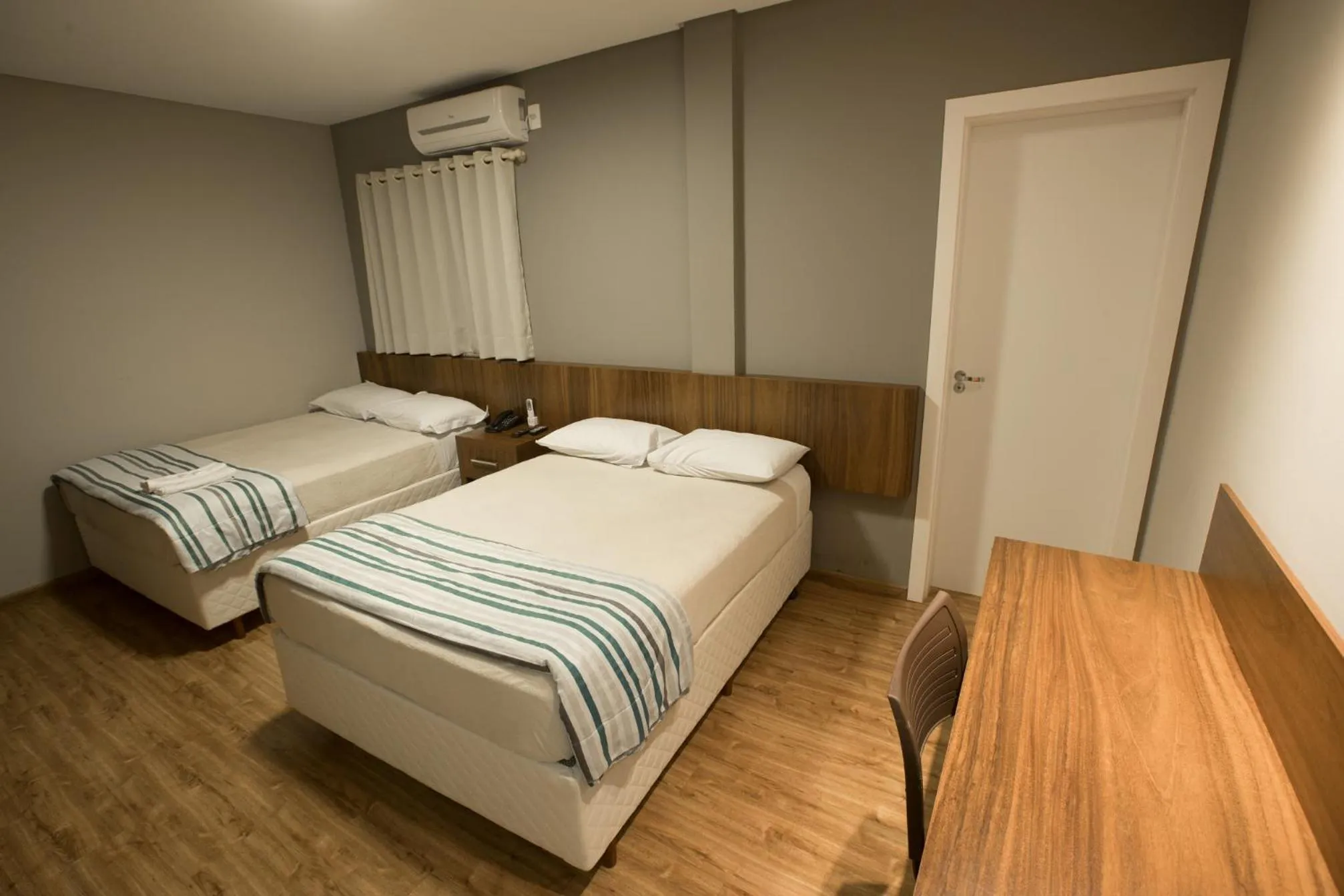 Bed in Ipê Hotel Express