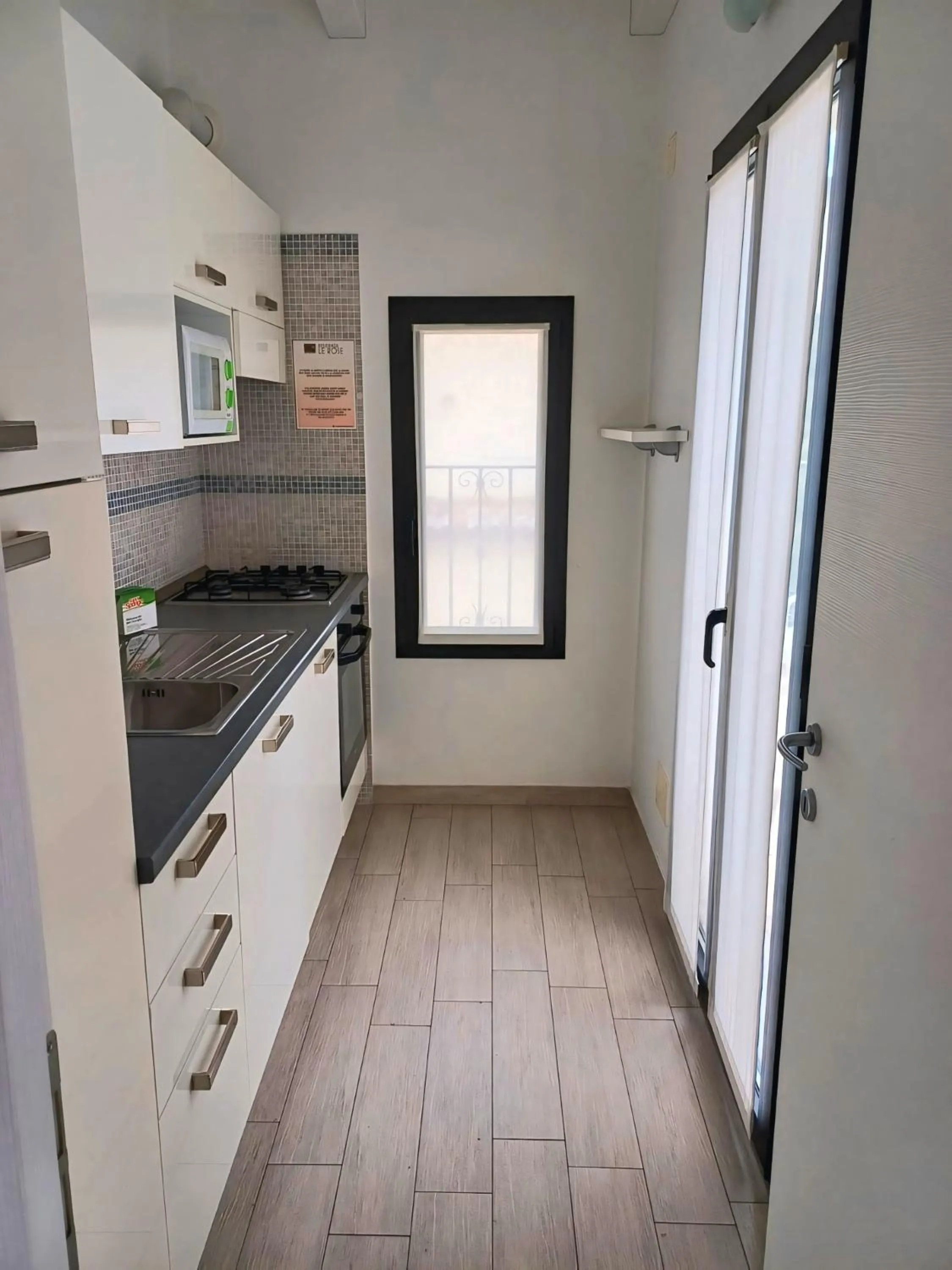 Kitchen or kitchenette in Le Rose Residence & Bici House