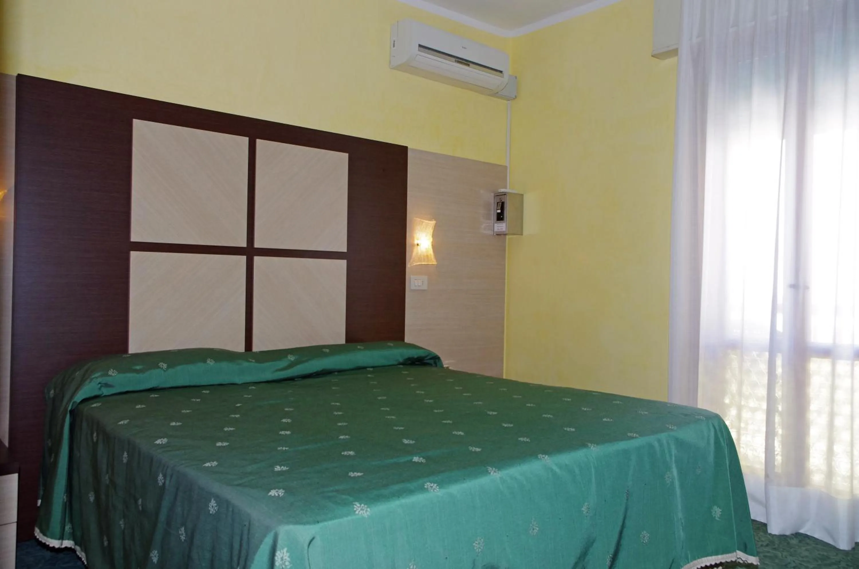 Bed in Hotel Gardenia