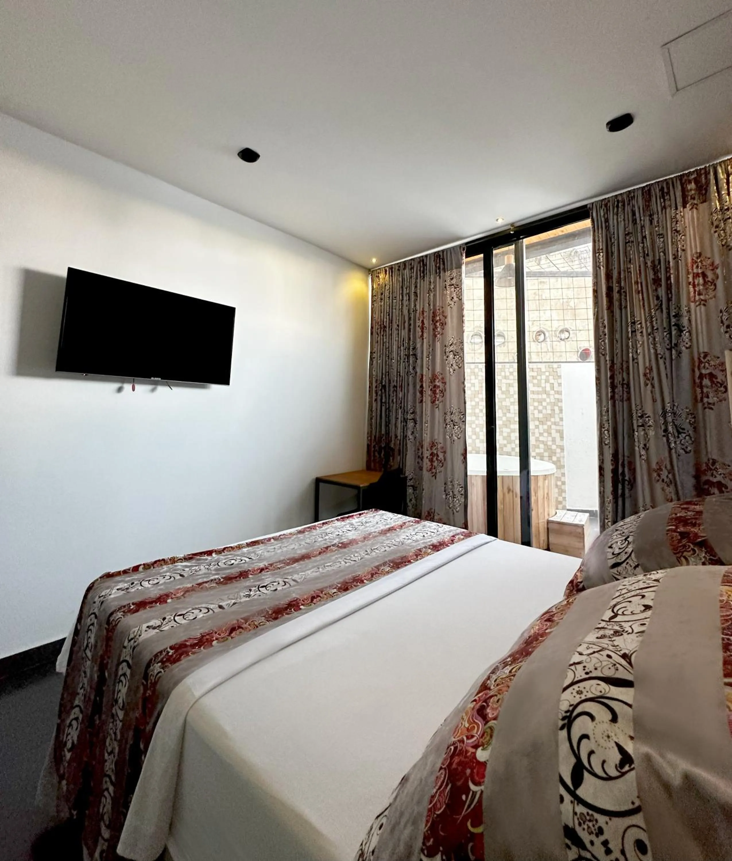 Communal lounge/ TV room, Bed in Hotel Cartagena DC