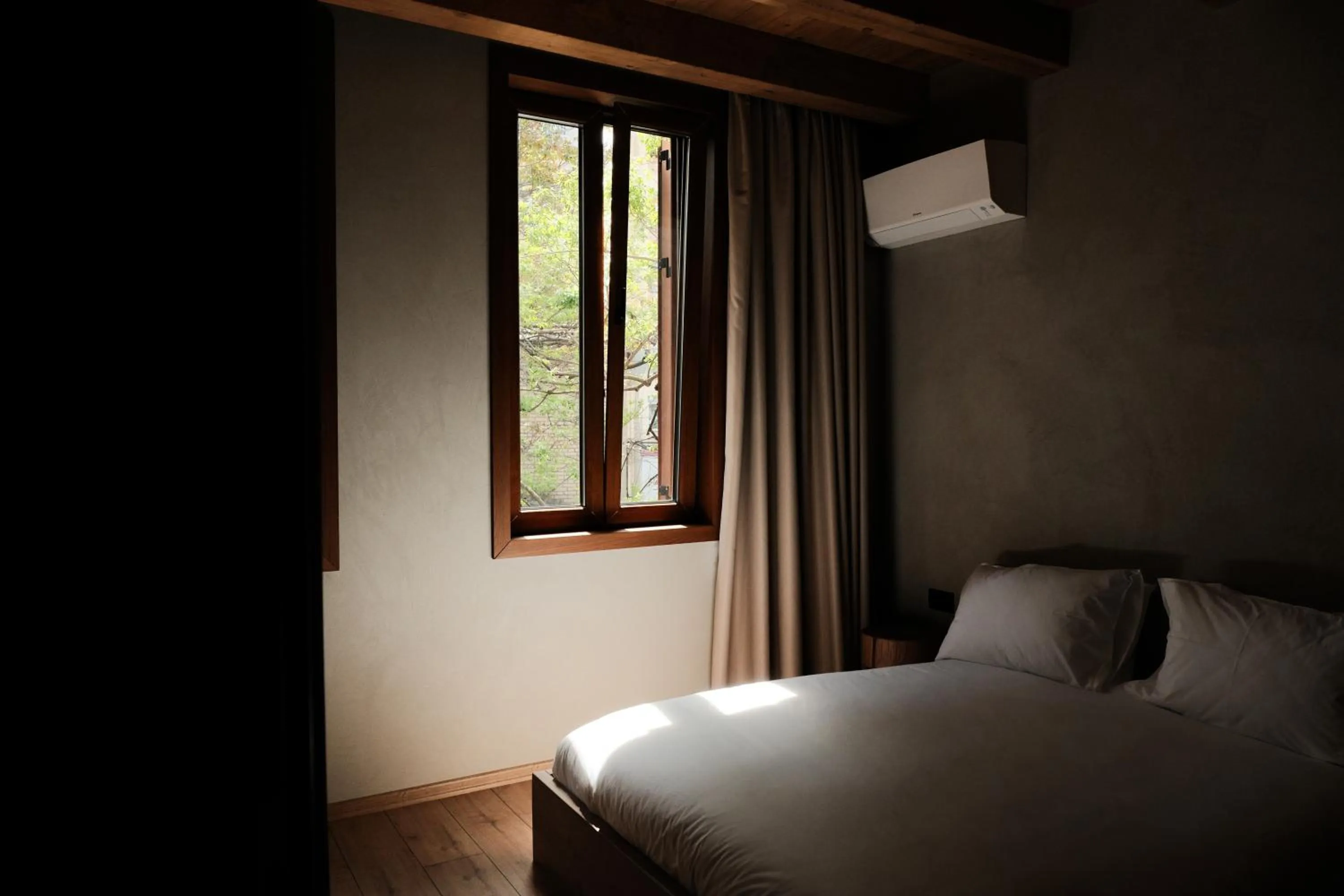 Bed in Faces & Places Boutique Hotel