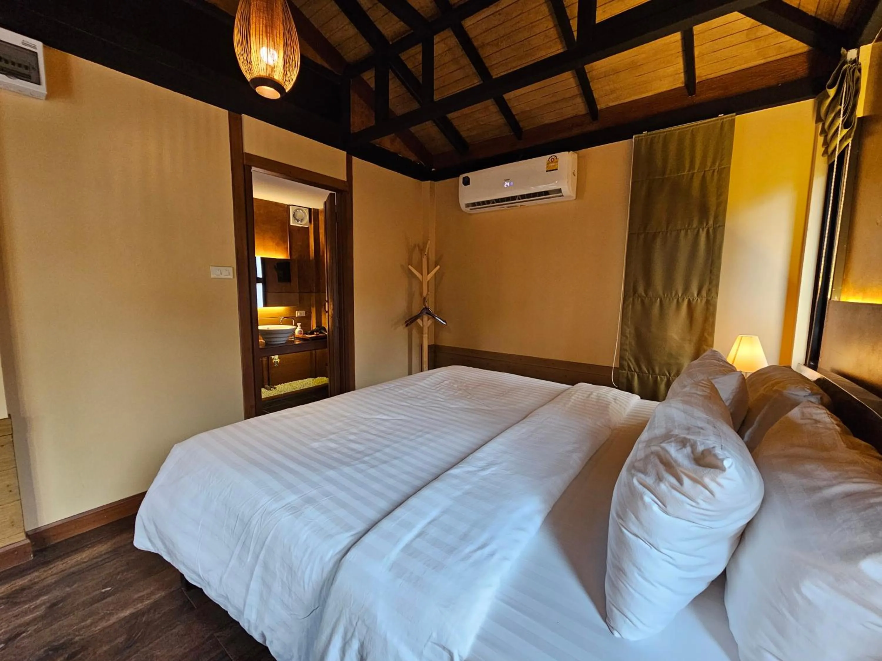 Bed in R1 Resort Rajapruek Chiangmai