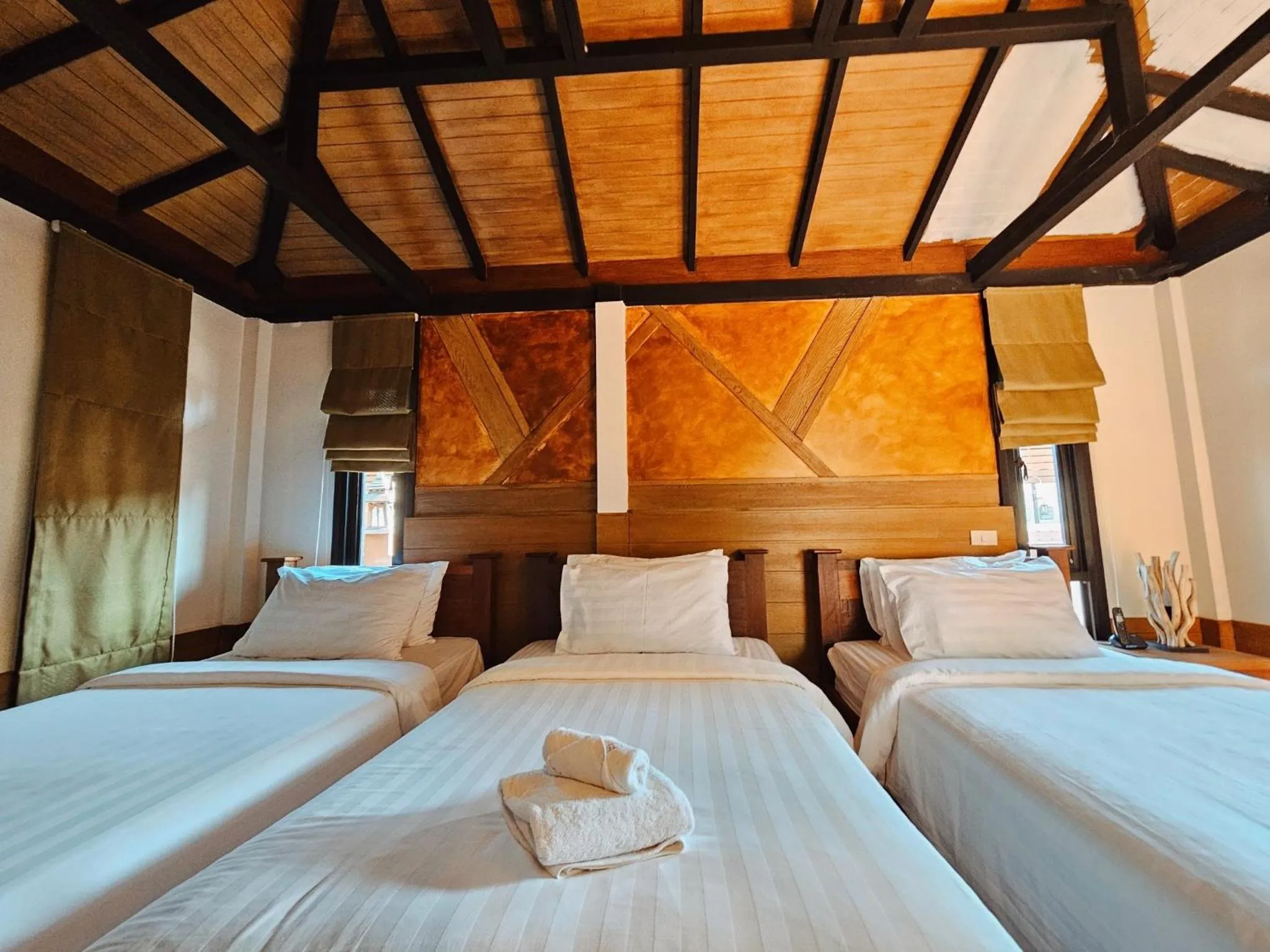 Bed in R1 Resort Rajapruek Chiangmai