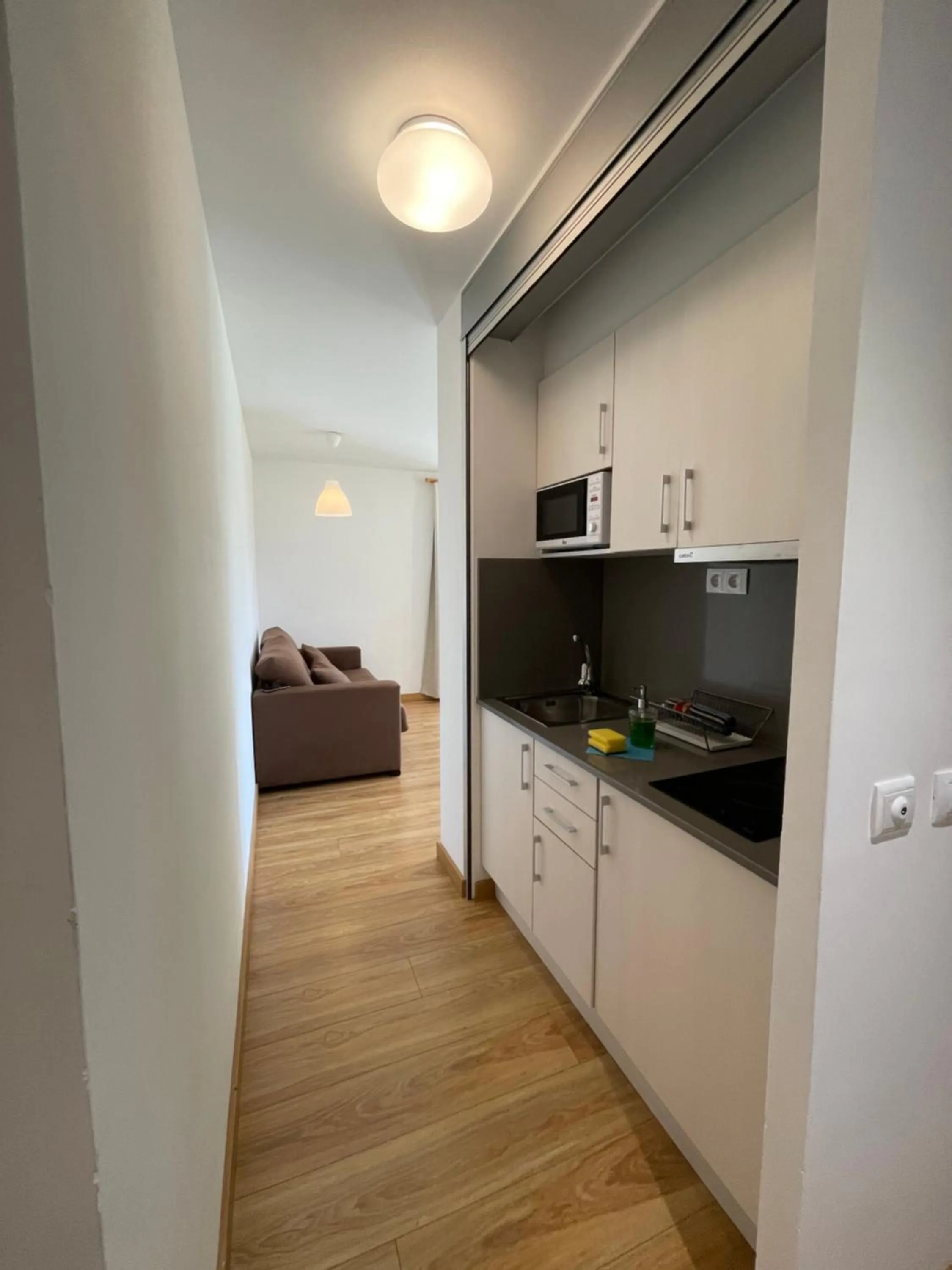 Kitchen or kitchenette in Aparthotel Sant Andreu