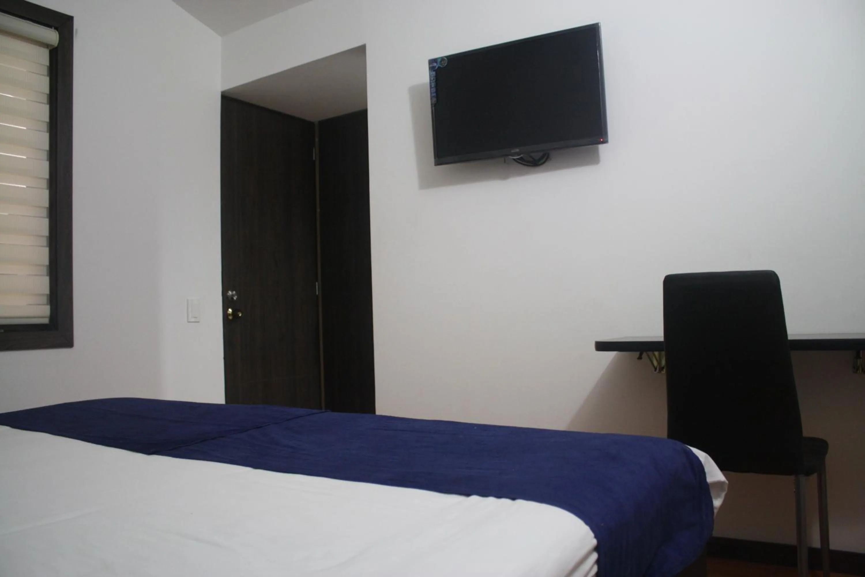 Bed in Stay Blue Hotel