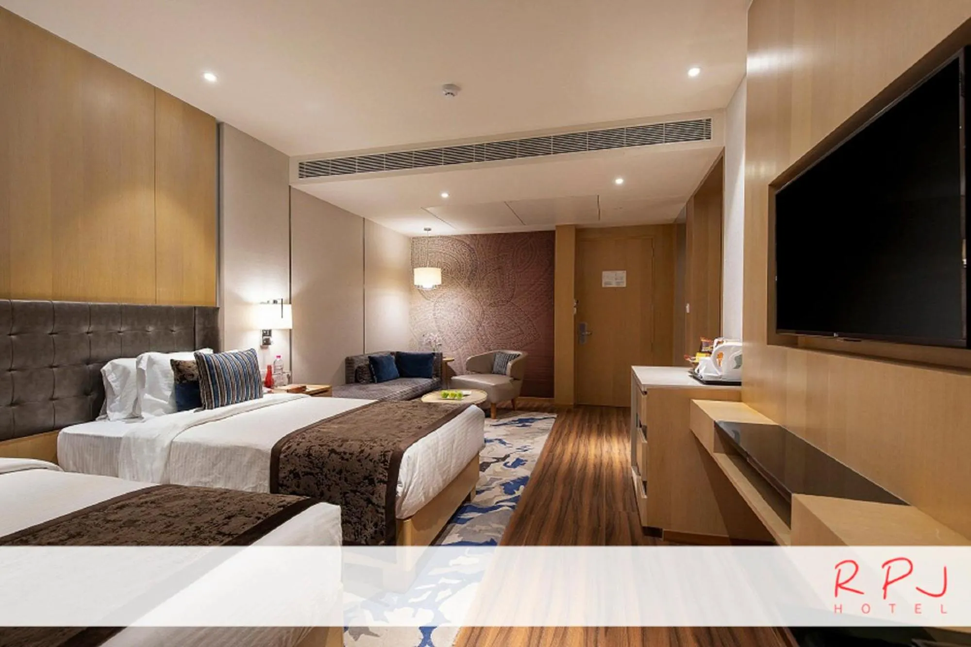 Photo of the whole room, Bed in RPJ Hotel Rajkot