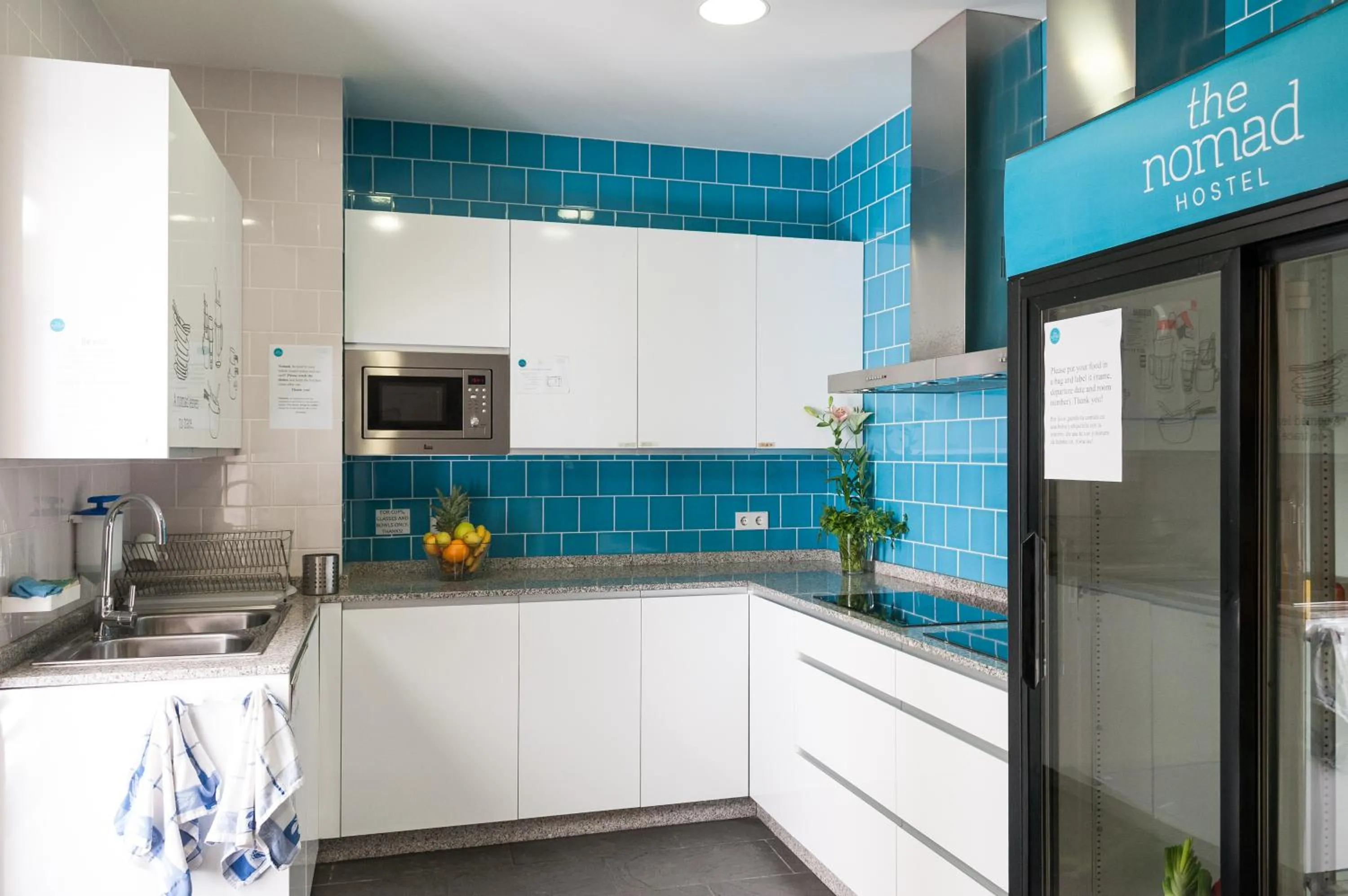 Communal kitchen in The Nomad Hostel&Pension