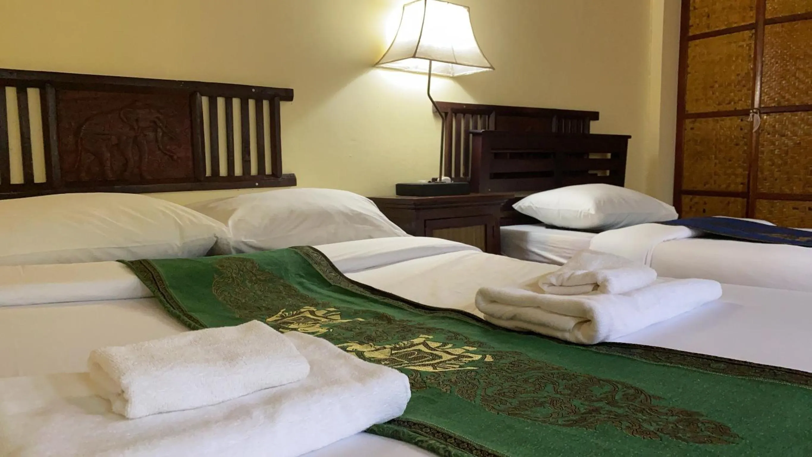 Bed in Golden Triangle Palace Hotel