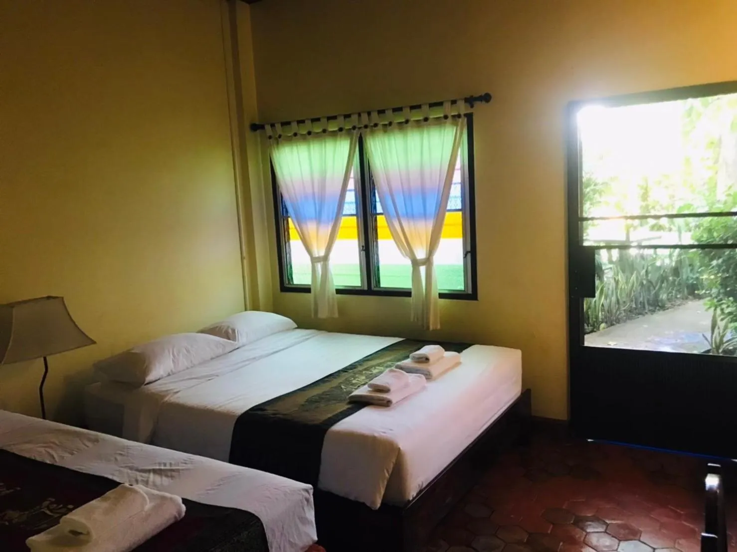 Bed in Golden Triangle Palace Hotel