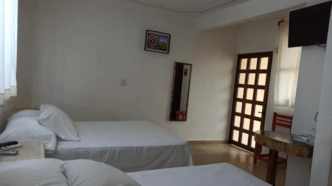 Bed in QUINTA DIAMANTE villas&hotel