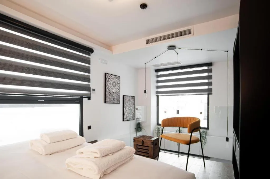 Bed in SIGMA Suites Hotel