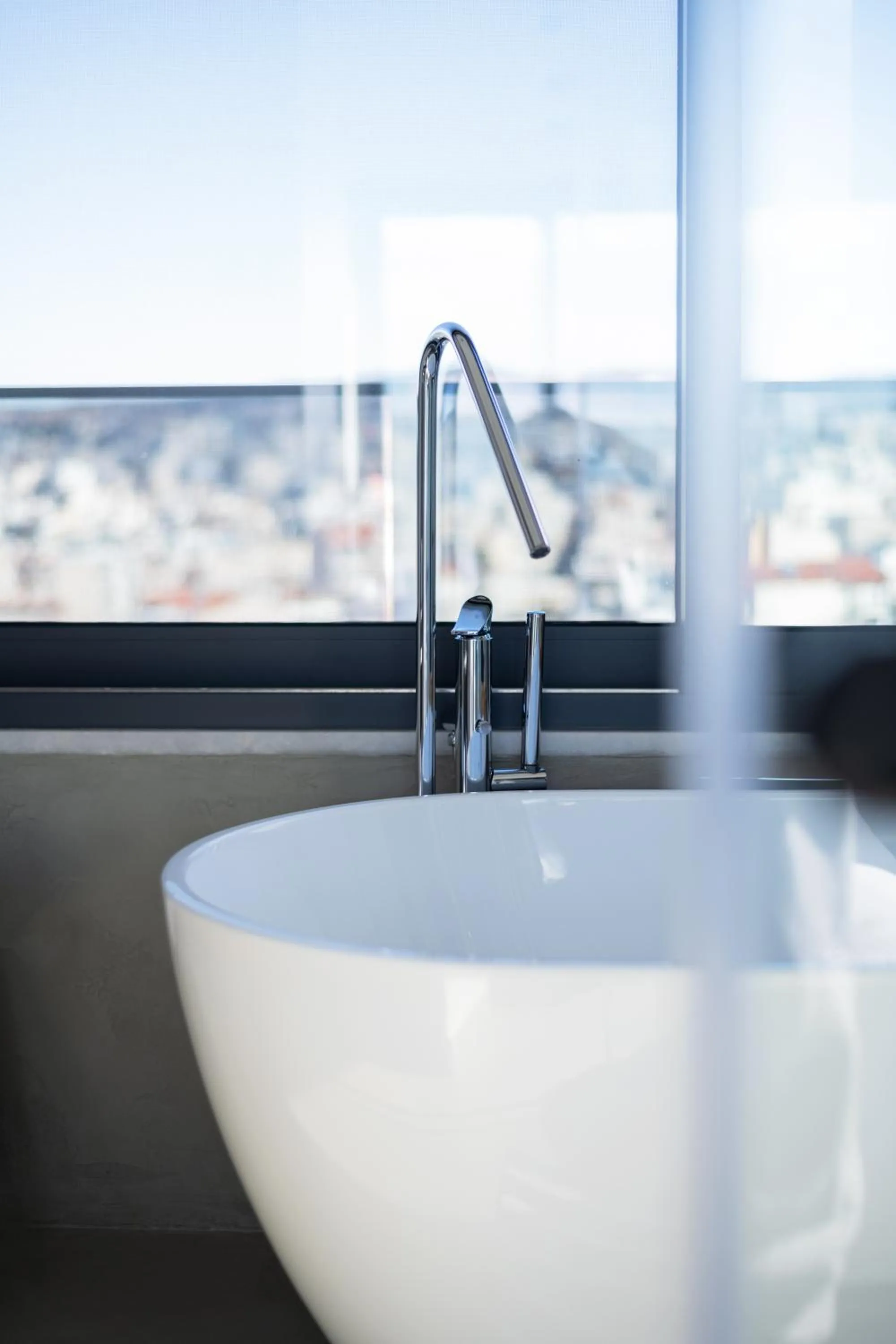 Bath in SIGMA Suites Hotel