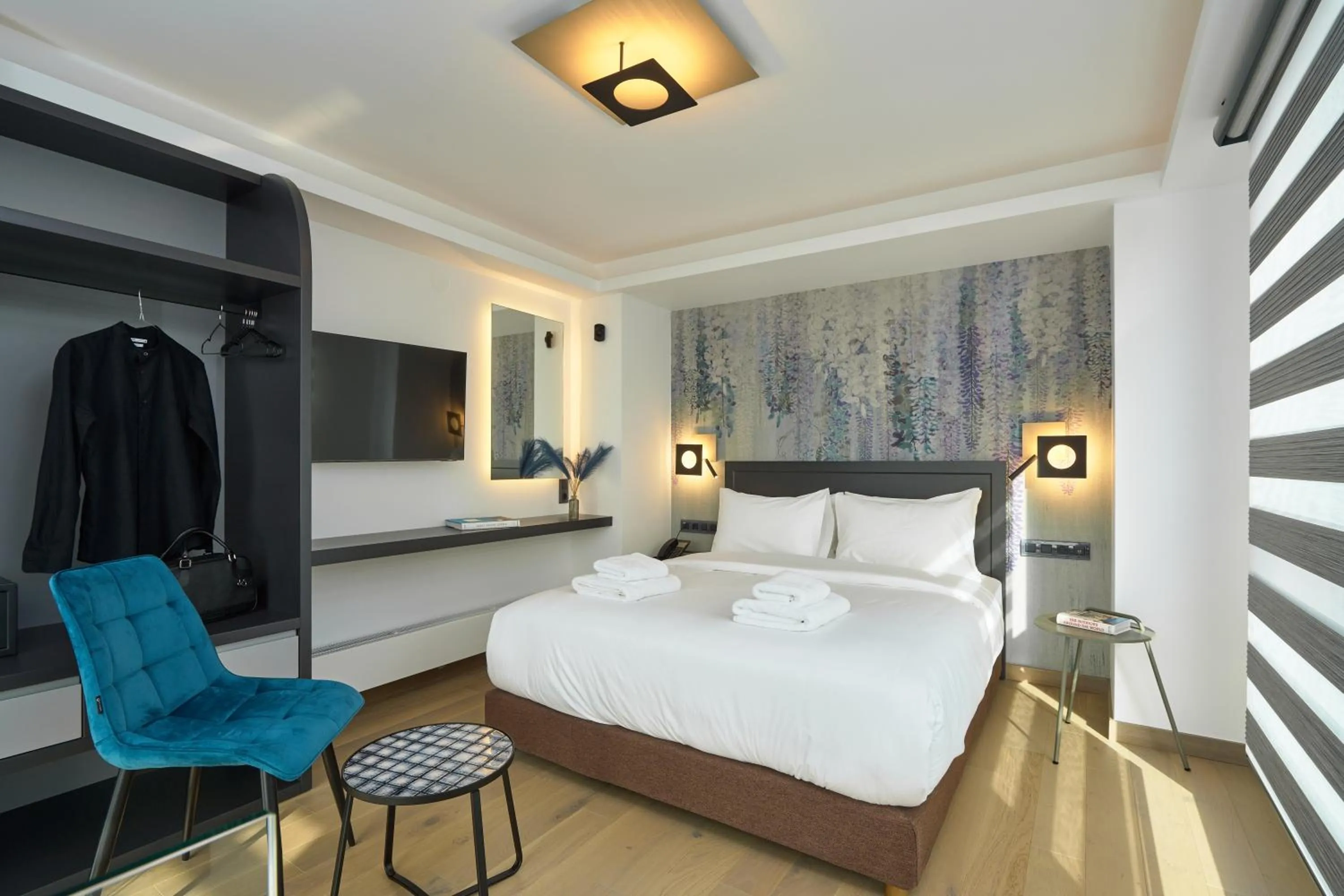 Bed in SIGMA Suites Hotel