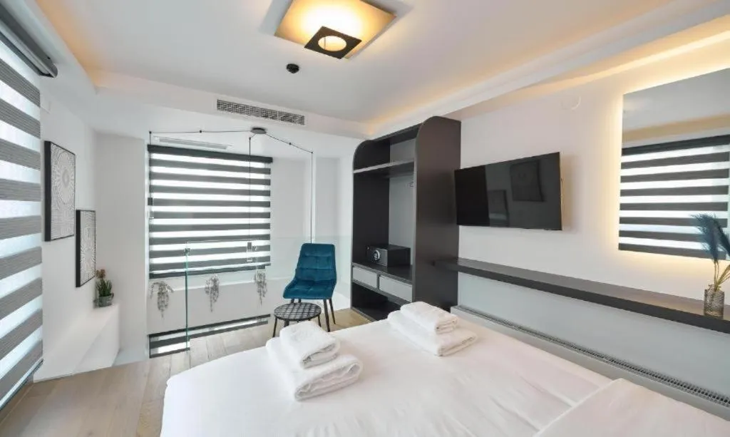 Bed in SIGMA Suites Hotel