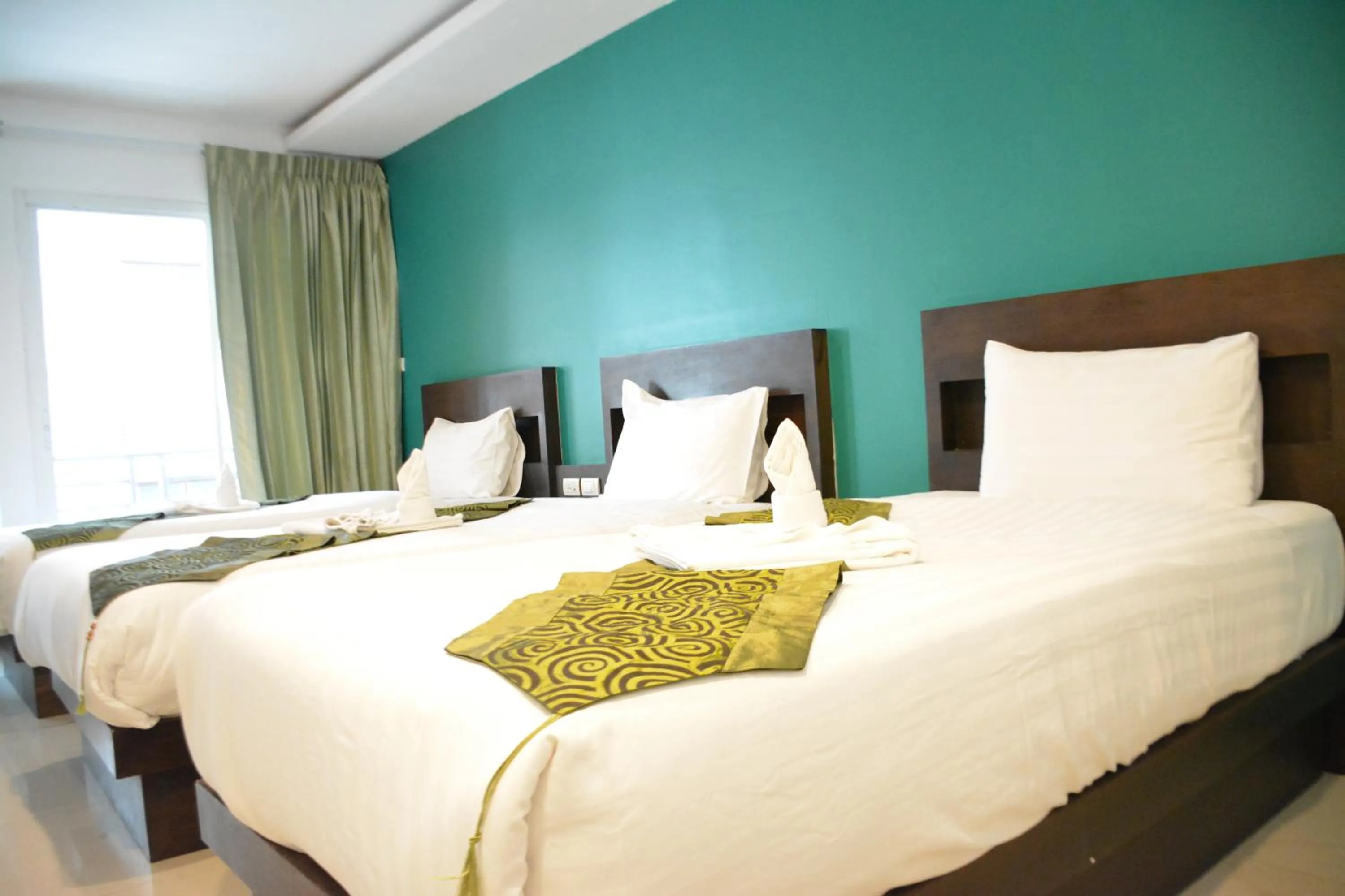 Bed in Zephyr Grand Hotel