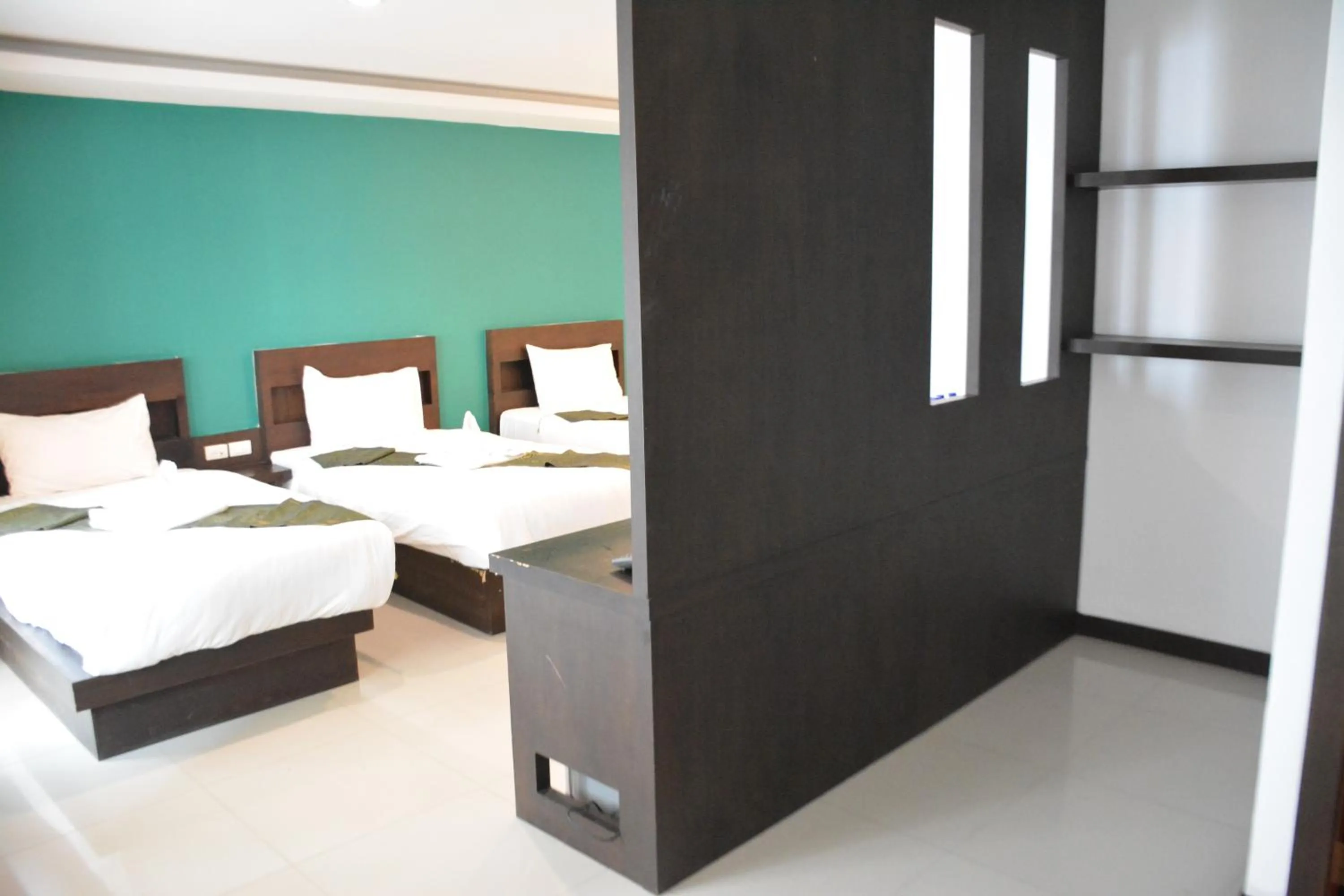 Bed in Zephyr Grand Hotel