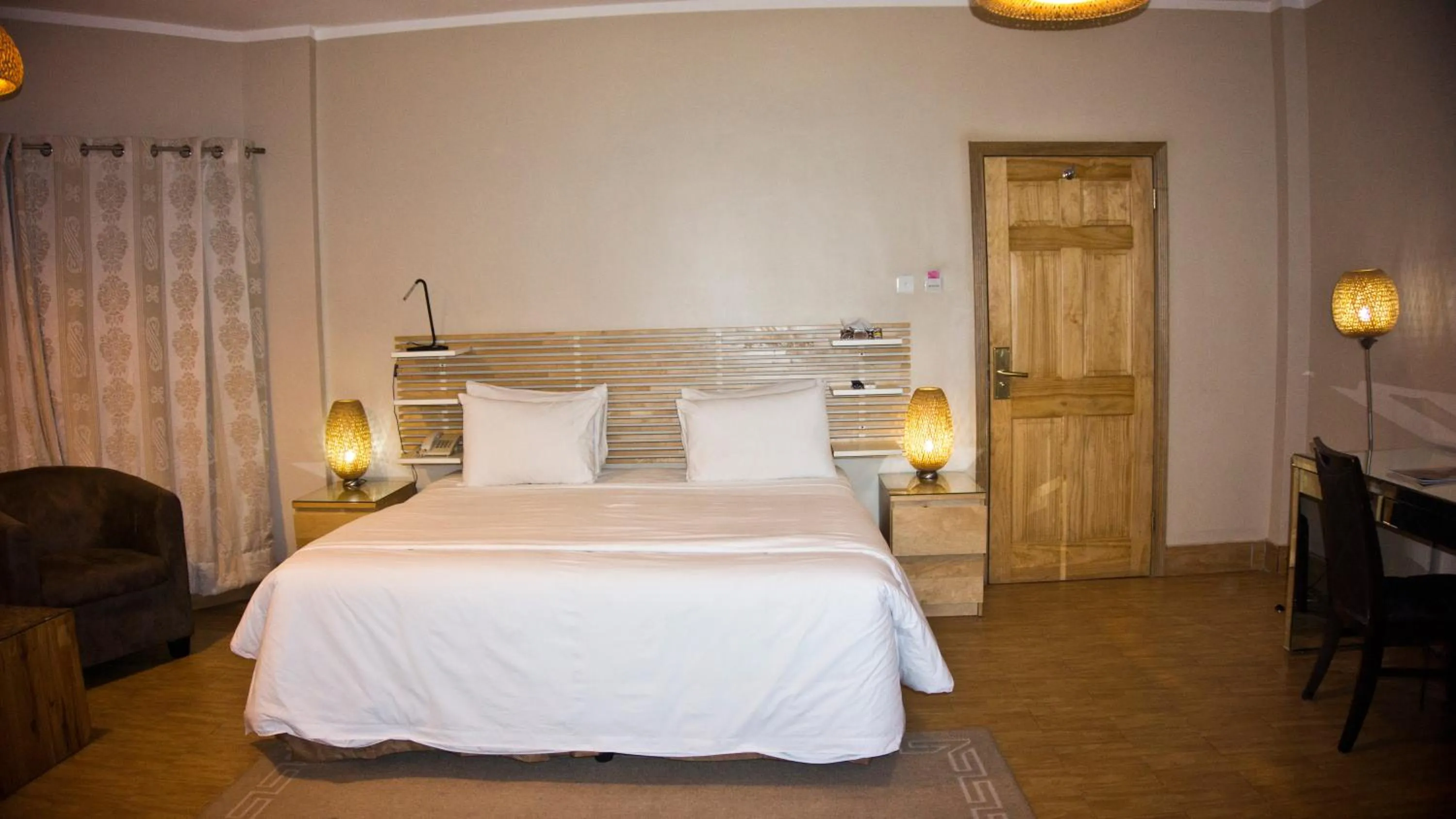 Photo of the whole room, Bed in Tropical Enclave Hotel