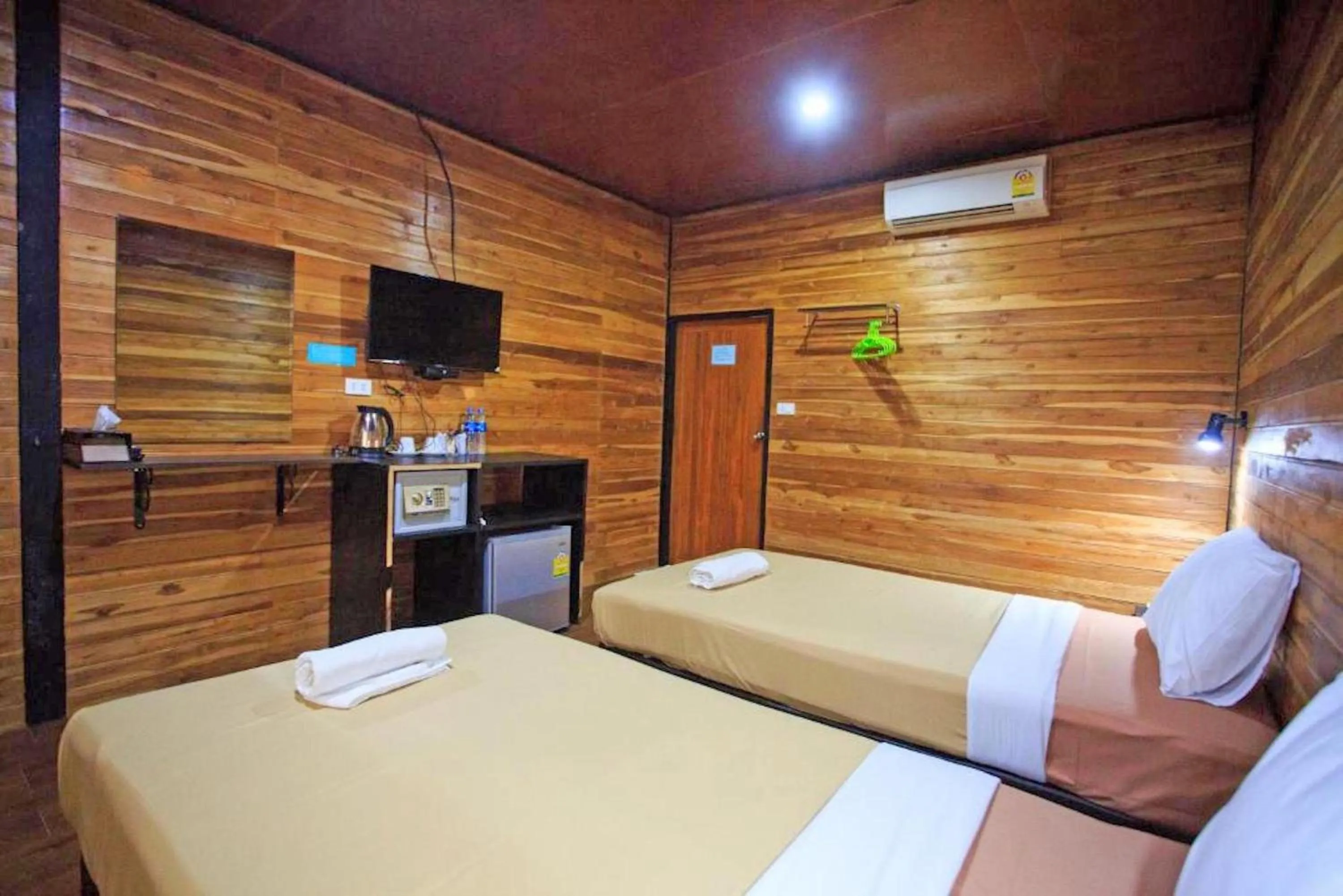 Photo of the whole room, Bed in The Cobble Beach Hotel- Phi Phi Island