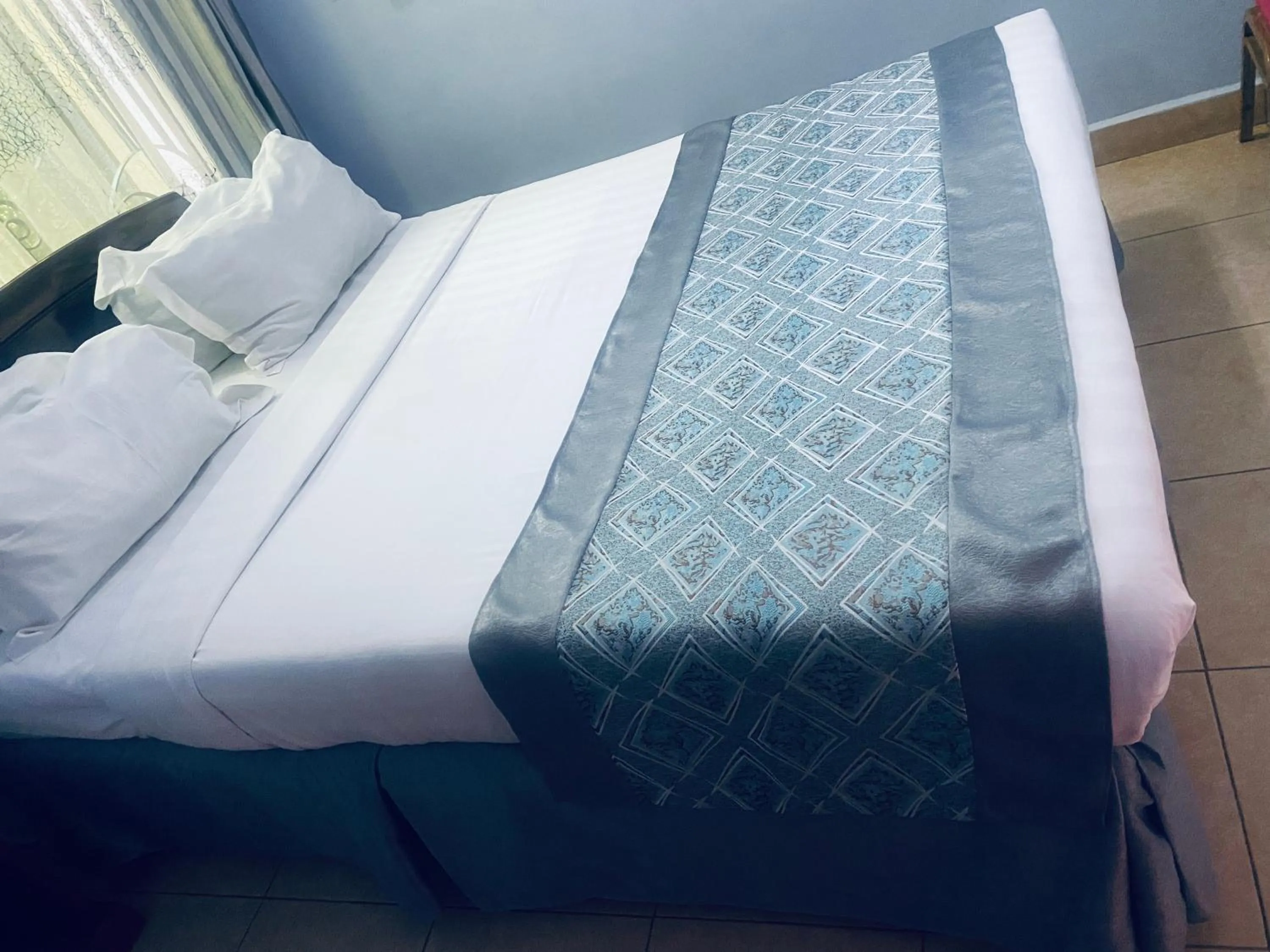 Bed in Green Mountain Hotel