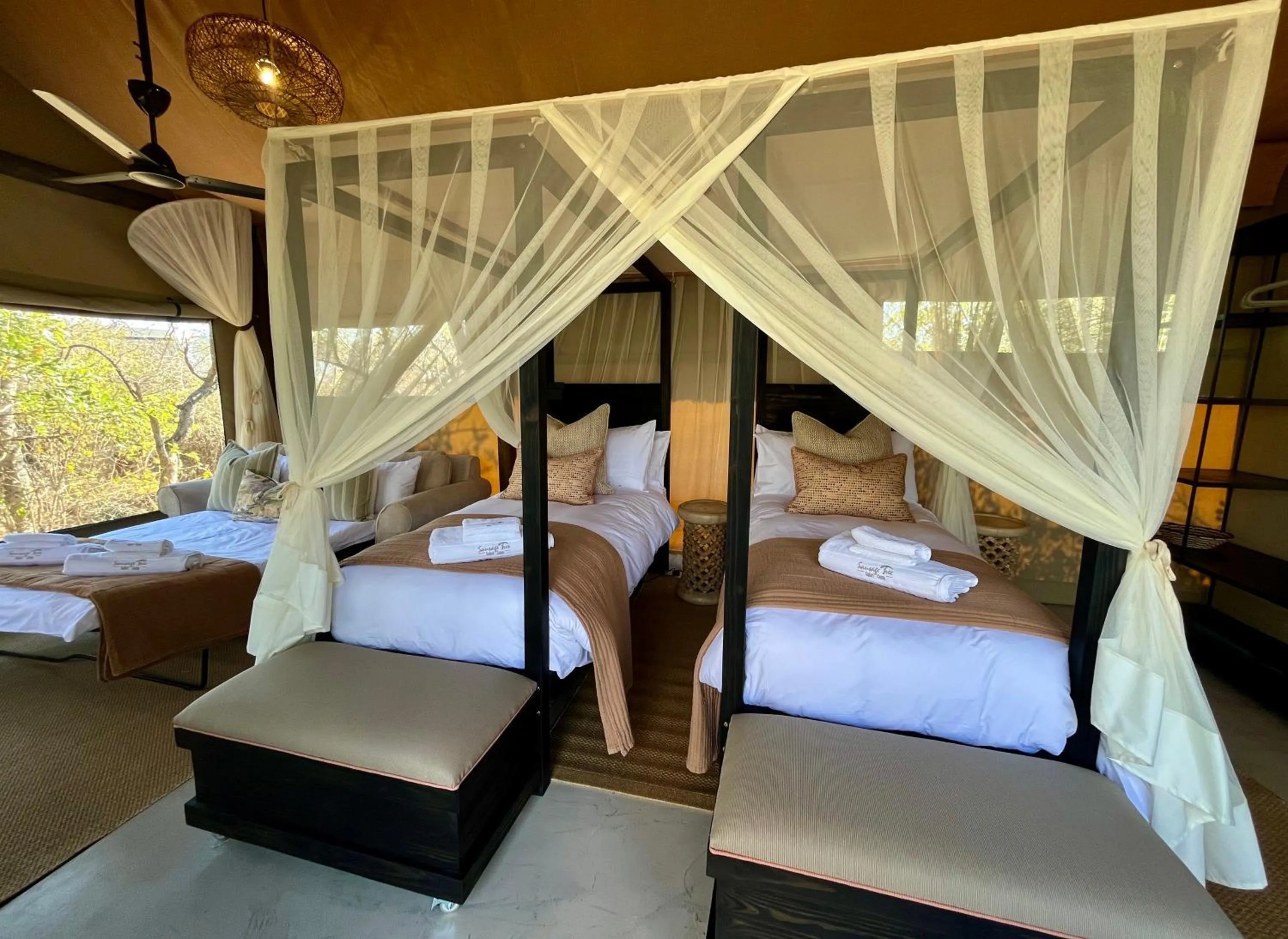 Property building, Bed in Sausage Tree Safari Camp