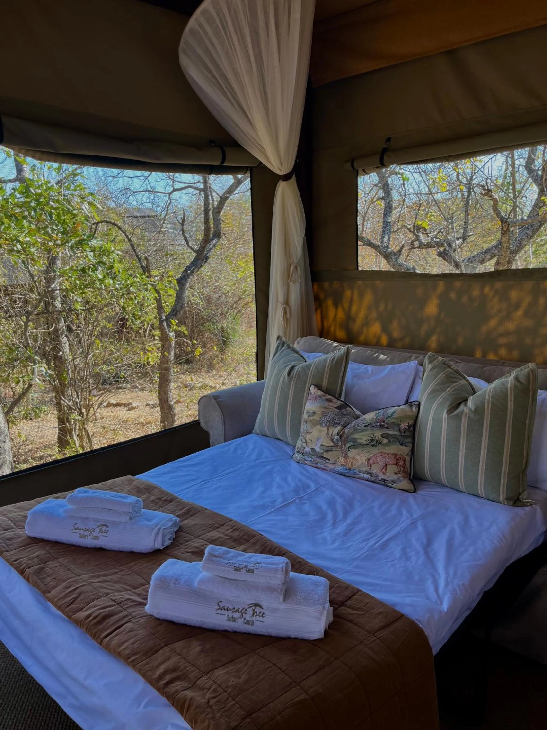 Property building, Bed in Sausage Tree Safari Camp