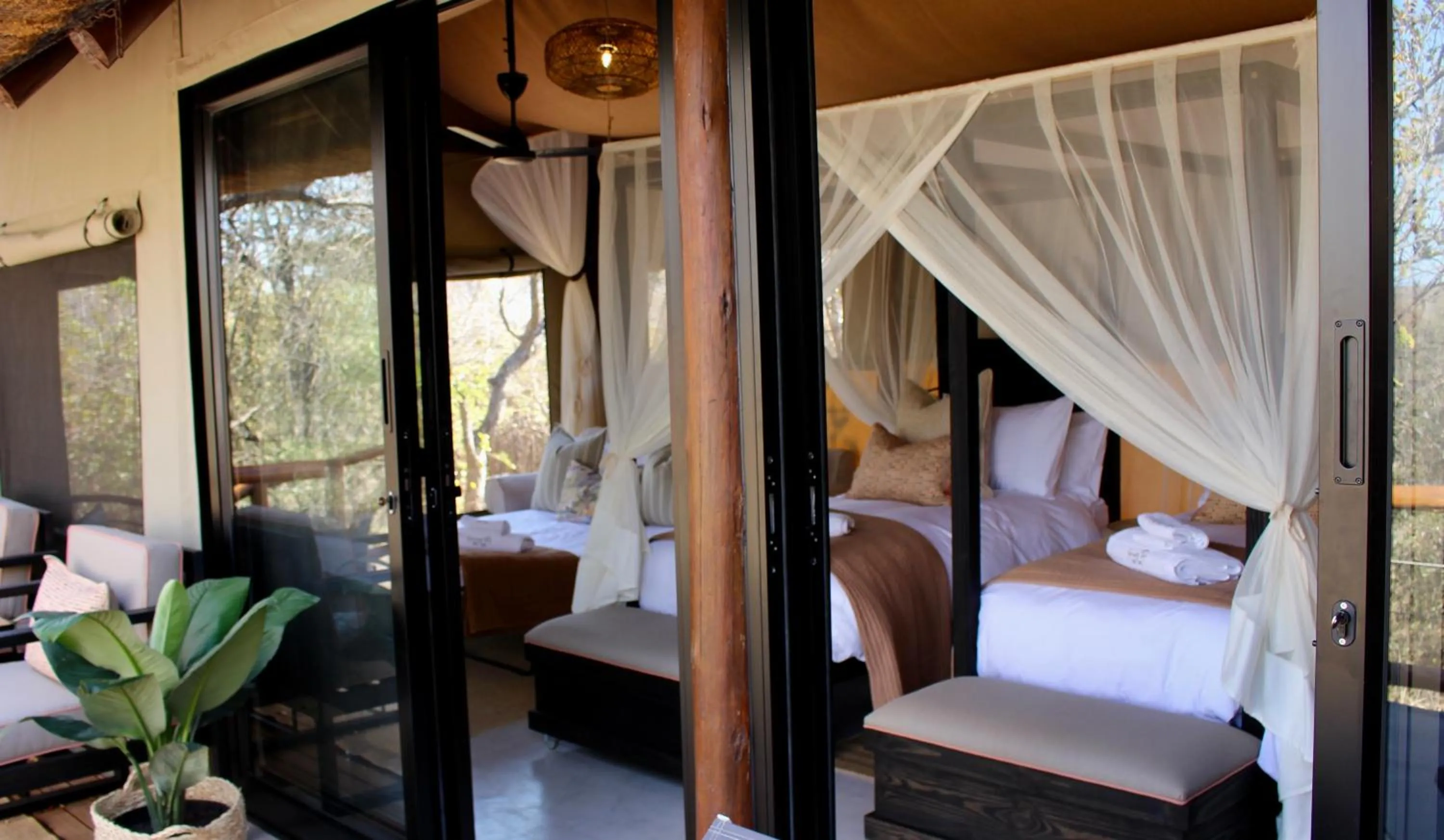 Property building, Bed in Sausage Tree Safari Camp